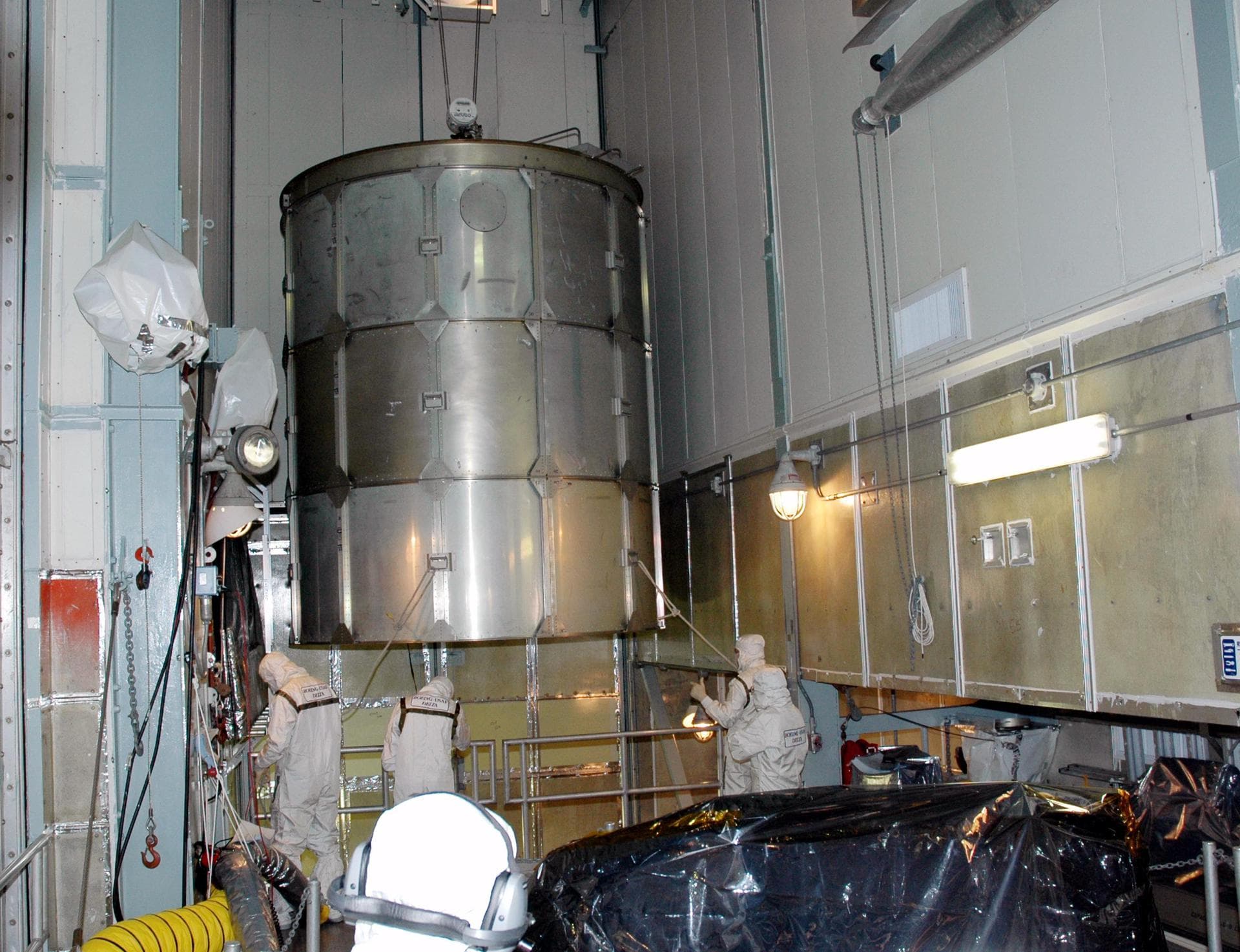 KENNEDY SPACE CENTER, FLA. -  Inside the mobile service tower on Launch Pad 17-A , Cape Canaveral Air Force Station, Fla., the upper portion of the transport canister is moved away after being lifted 