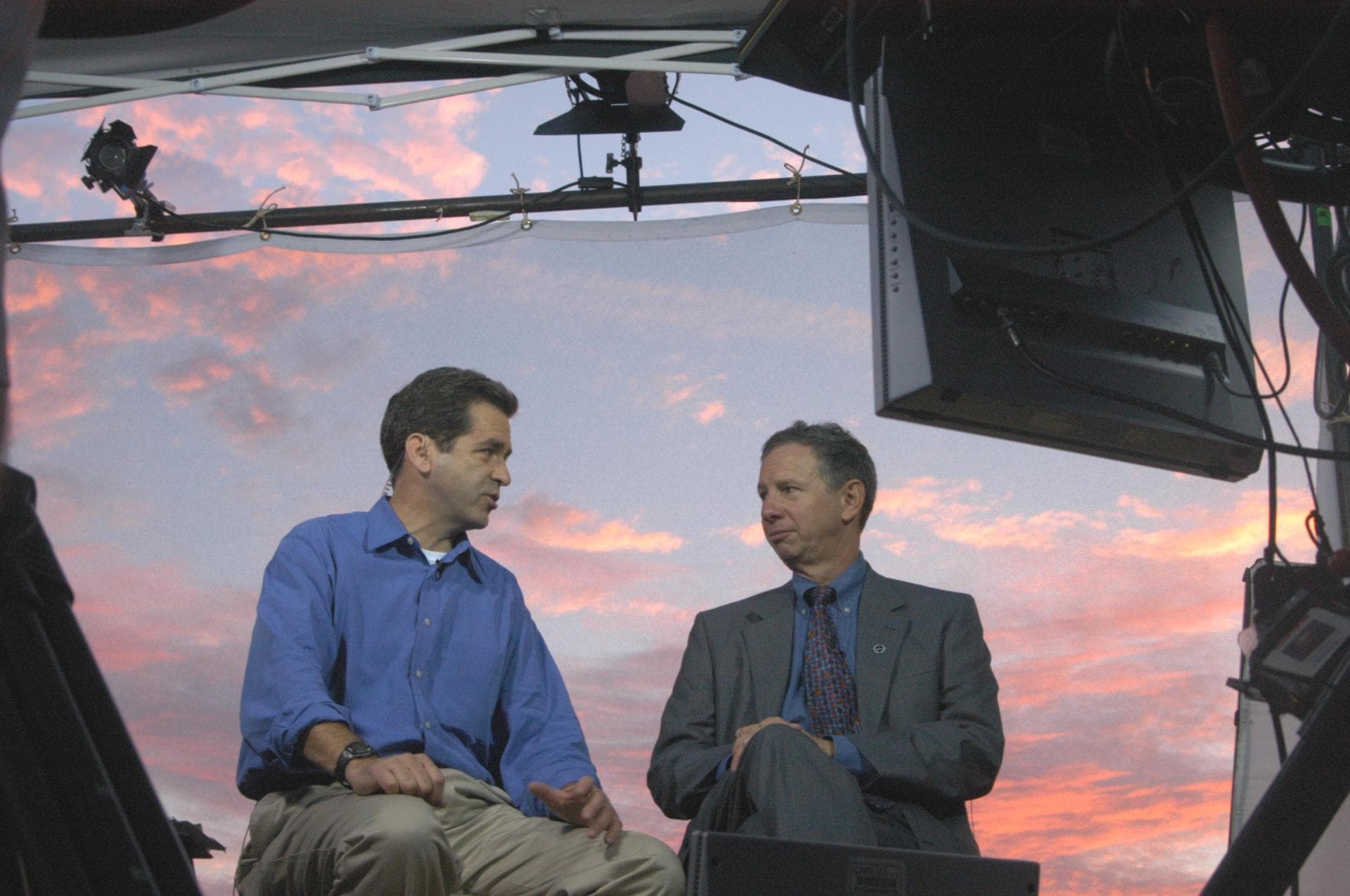 KENNEDY SPACE CENTER, FLA. -   Against a sunrise-painted sky at NASA Kennedy Space Center, co-anchor on CNN’s American Morning, talks on air with NASA Administrator Mike Griffin about the pending 3:51