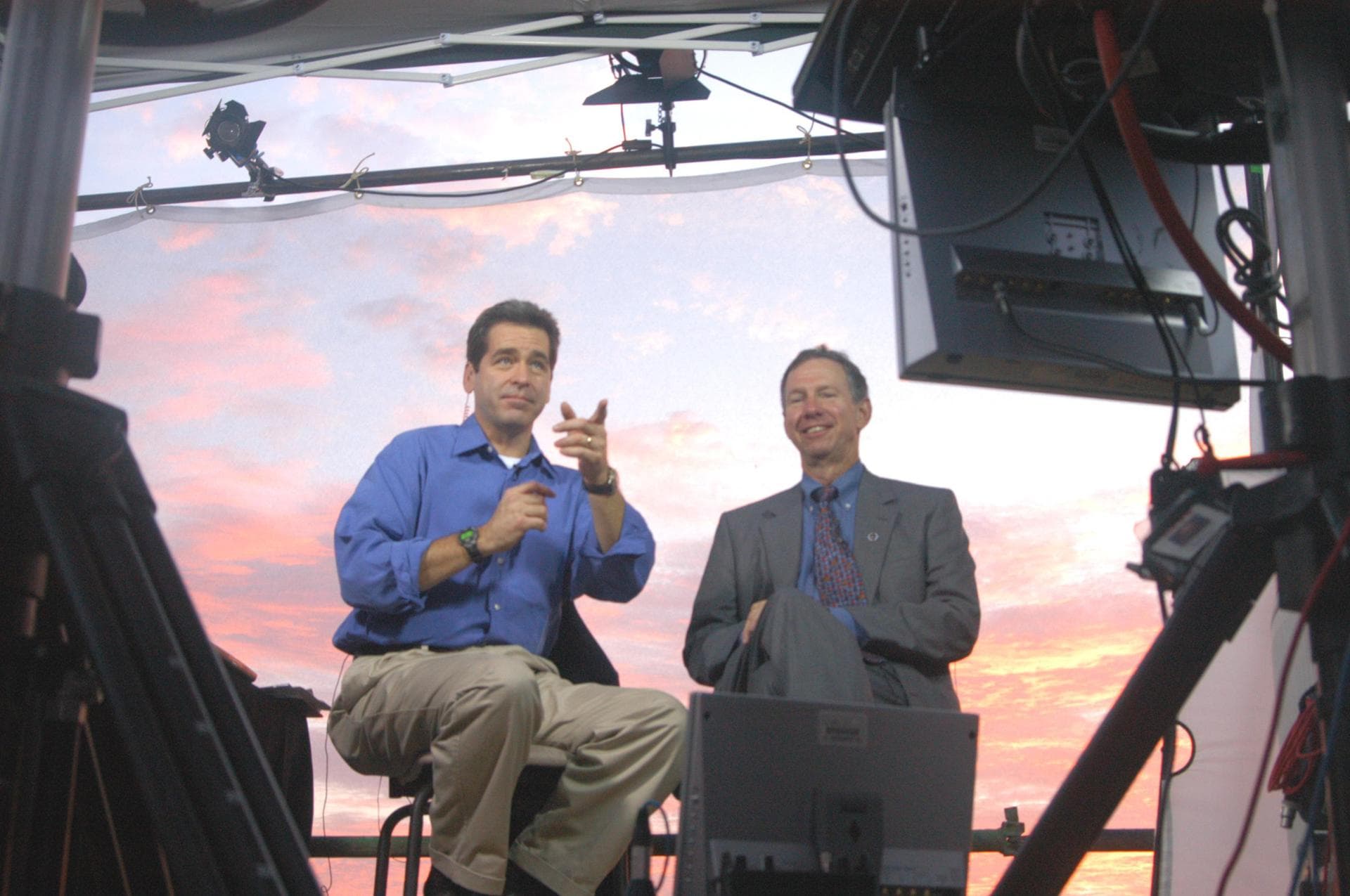KENNEDY SPACE CENTER, FLA. -   Against a sunrise-painted sky at NASA Kennedy Space Center, Miles O’Brien (left), co-anchor on CNN’s American Morning,  talks on air with NASA Administrator Mike Griffin