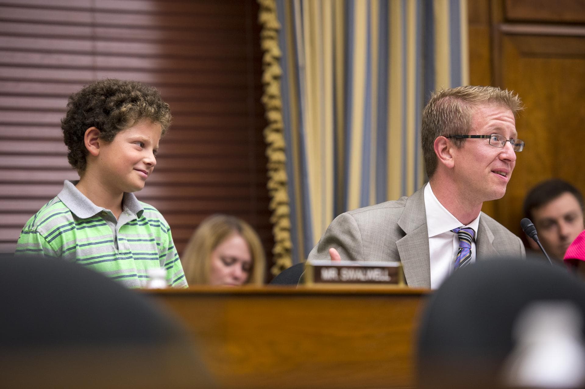 Congressman Derek Kilmer asks astronauts Steve Swanson and Reid Wisemen a question on behalf of a young audience member at the live downlink with the International Space Station (ISS) Thursday, July 2