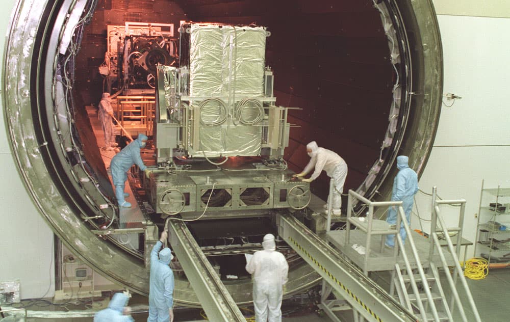 This photograph captures the installation of the Chandra X-Ray Observatory, formerly Advanced X-Ray Astrophysics Facility (AXAF), Advanced Charged-Coupled Device (CCD) Imaging Spectrometer (ACIS) into