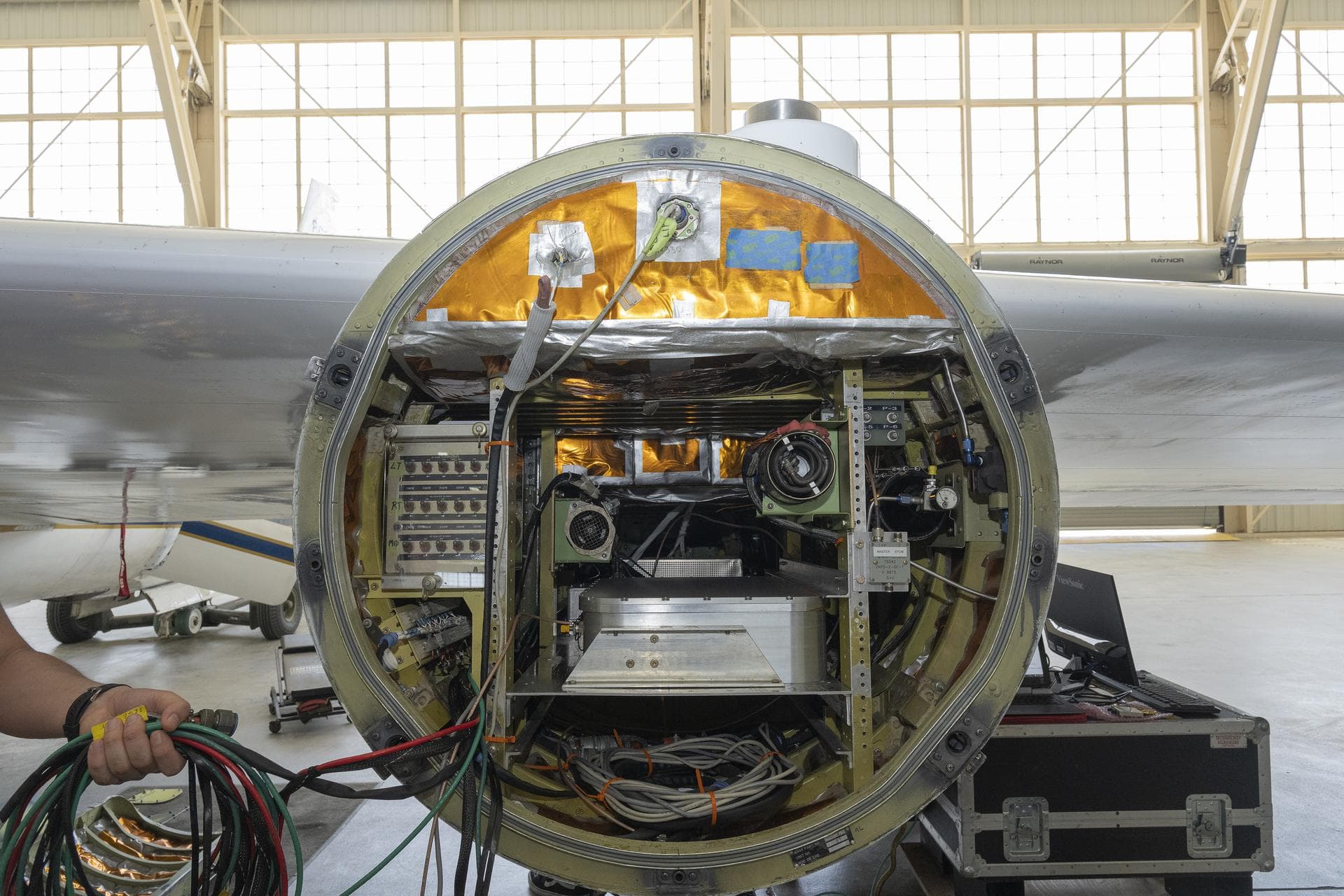 An ER‑2 aircraft based at NASA’s Armstrong Flight Research Center in Edwards, California, carries a pod full of instruments for the INjected Smoke and PYRocumulonimbus Experiment (INSPYRE) on Thursday
