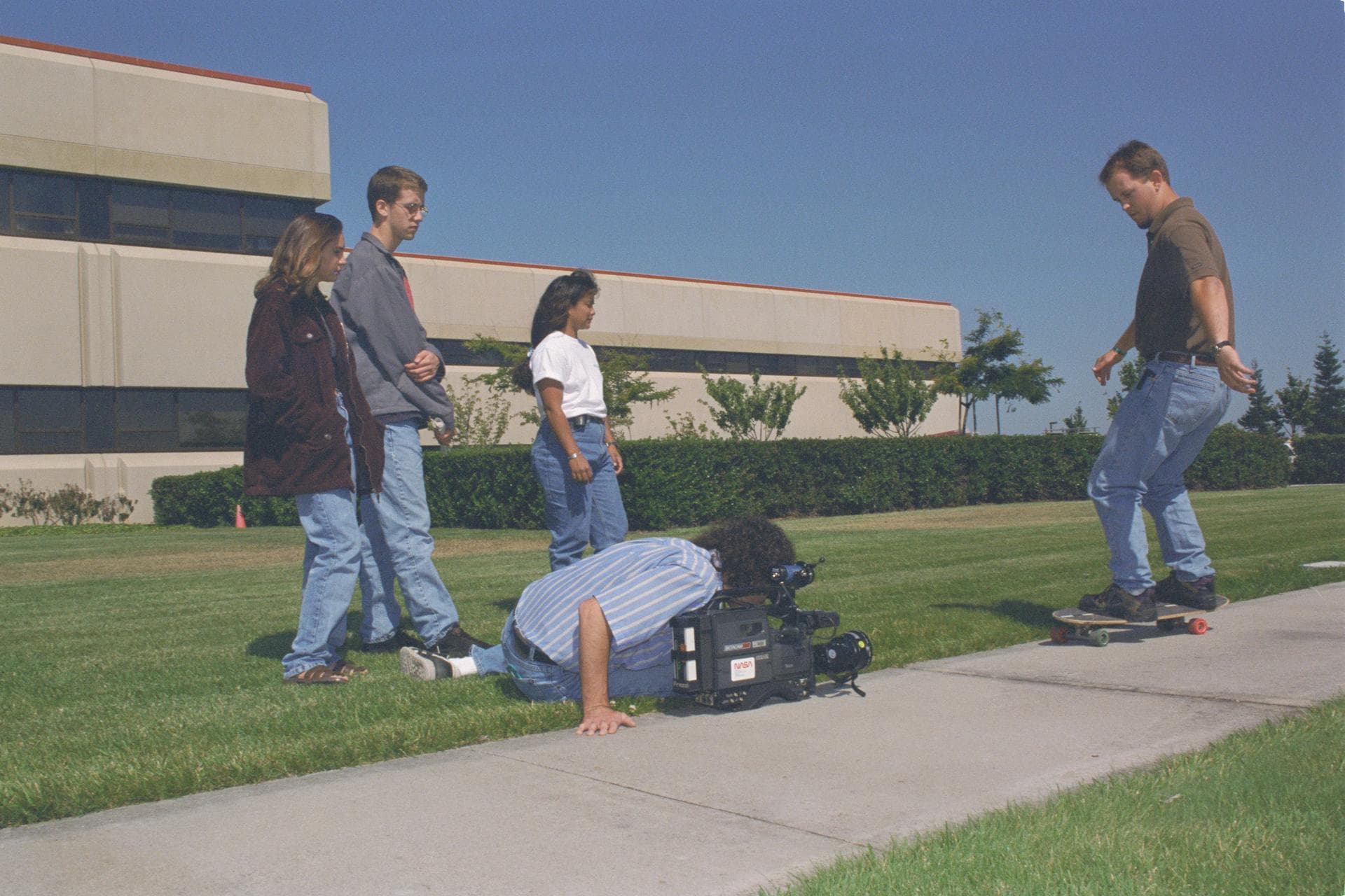 1996 MCP (Multimedia Curriculum Project) summer students practice techniques with Ames Documentation Technology Branch Video Groups' Patty Viajar and Adam Souza (photography student)