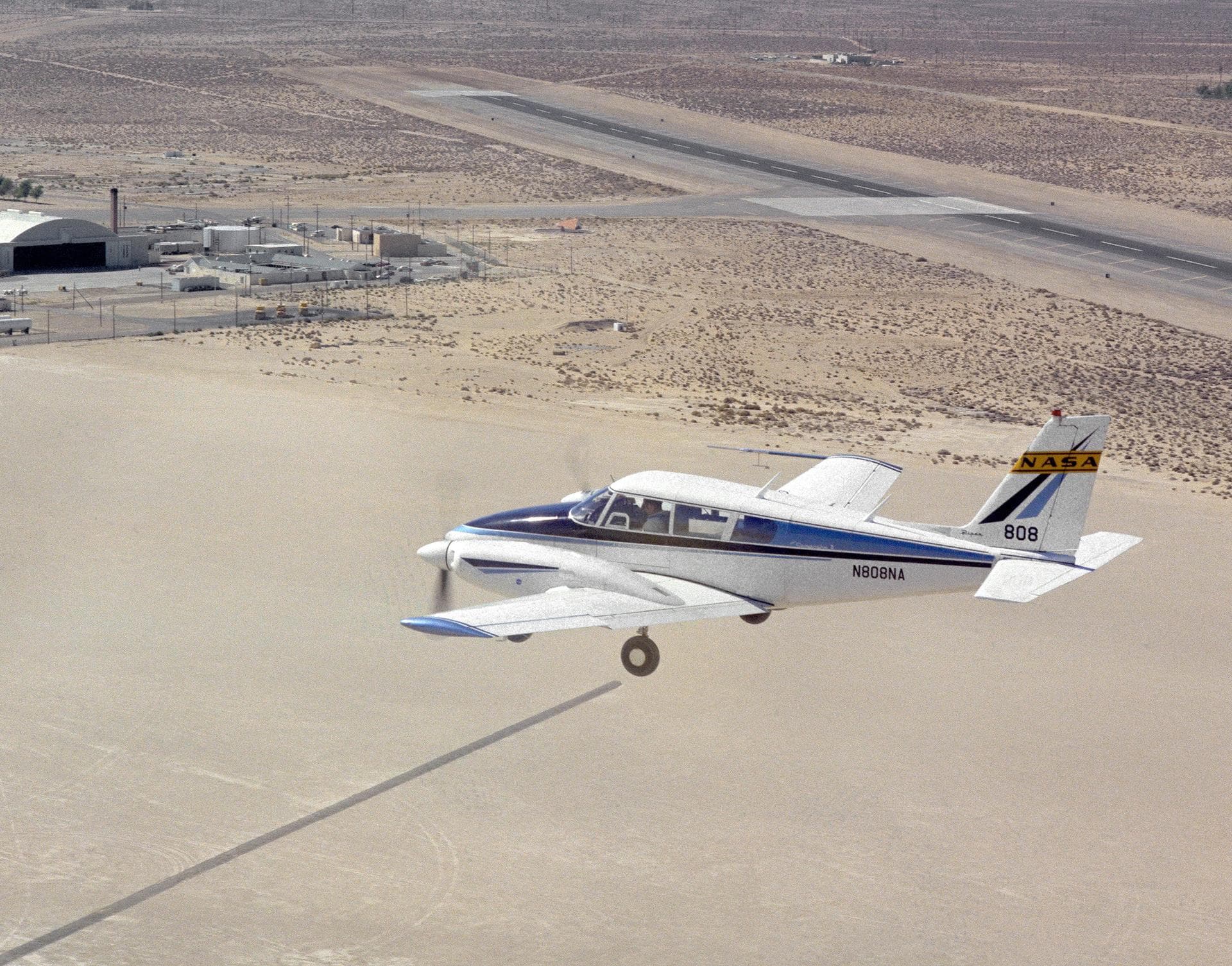 Dryden Flight Research Center's Piper PA-30 Twin Commanche, which helped validate the RPRV concept, descends to a remotely controlled landing on Rogers Dry Lake, unassisted by the onboard pilot. A Pip