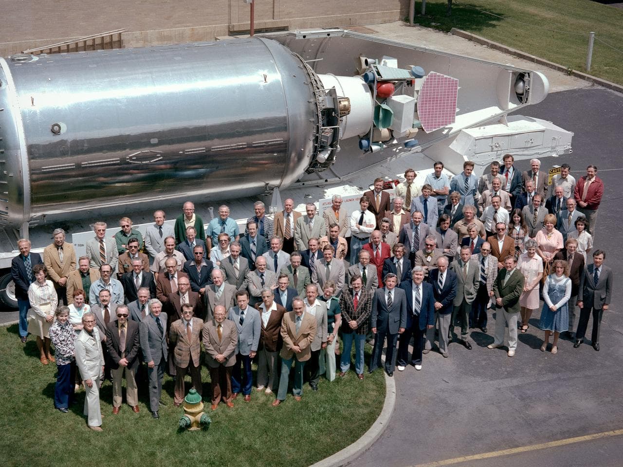 The National Aeronautics and Space Administration (NASA) Lewis Research Center’s Launch Vehicle Directorate in front of a full-scale model of the Centaur second-stage rocket. The photograph was taken 