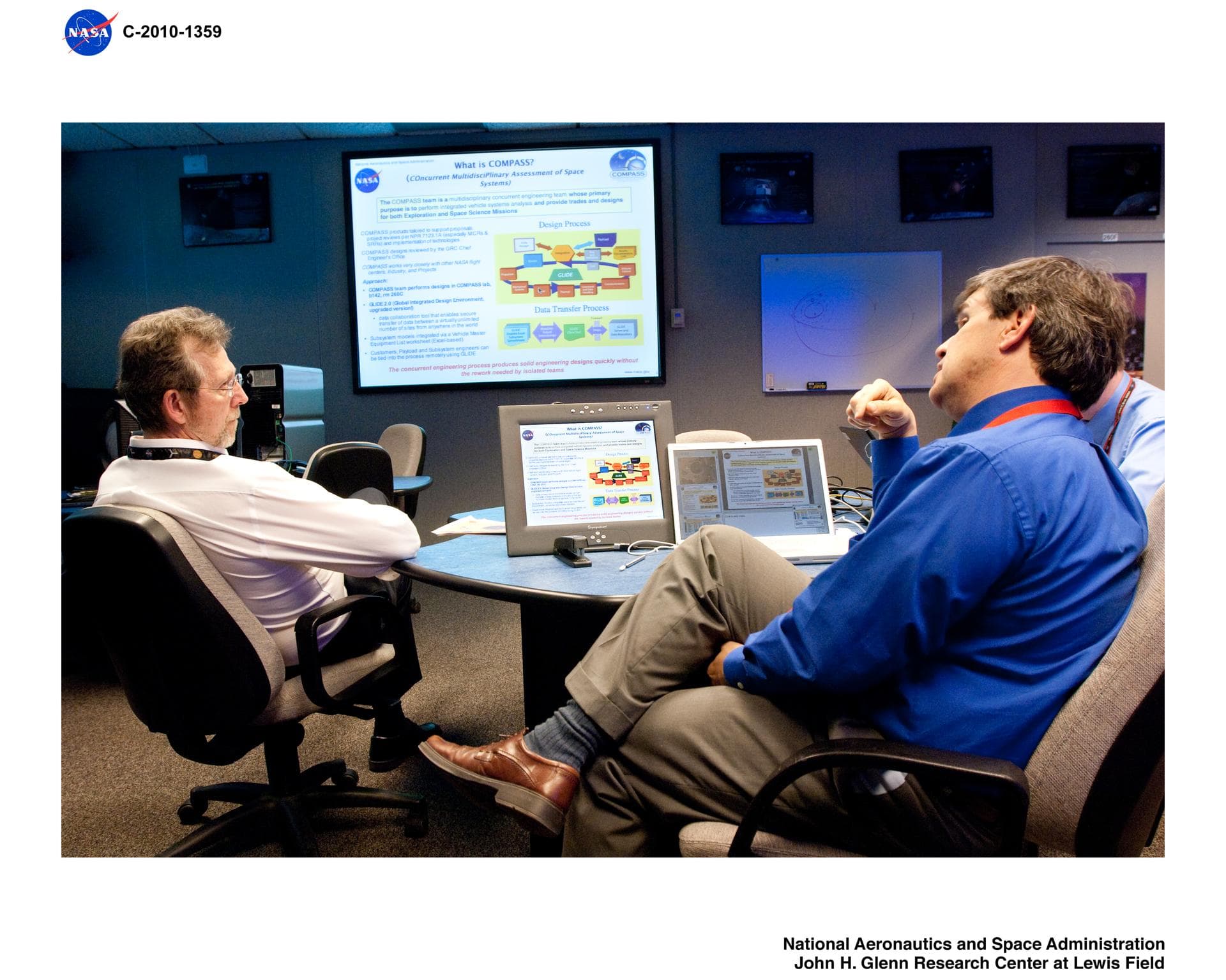 Planetary Science Lead, Jim Green being briefed on recent conceptual designs by the Lead of the COMPASS concurrent engineering design team at NASA Glenn Research Center.  COMPASS = COllaborative Model
