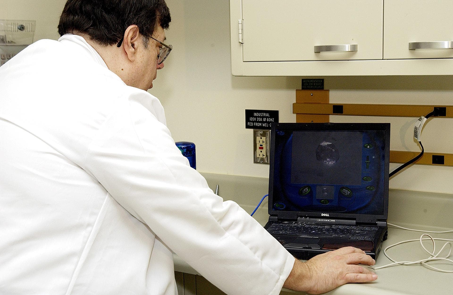 KENNEDY SPACE CENTER, FLA. -  Barry Perlman, Pembroke Pines Charter Middle School in Florida, prepares a computer to receive data from an experiment carried on mission STS-107. Several experiments wer