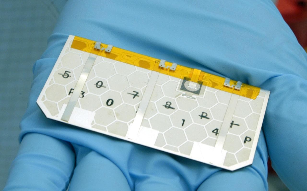 KENNEDY SPACE CENTER, FLA. -  A closeup of one of the solar cells that will be removed and replaced on the Swift spacecraft’s solar array.  Swift is a first-of-its-kind, multi-wavelength observatory d