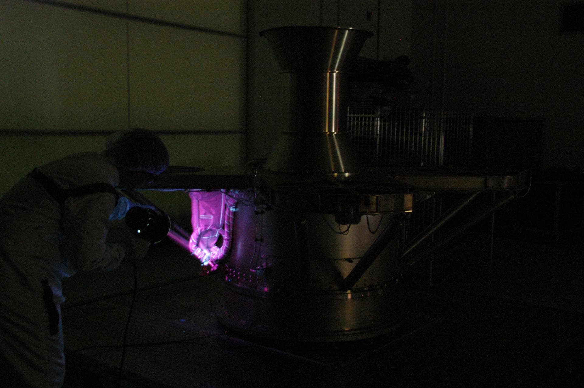 At Astrotech Space Operations, technicians conduct black light inspection of the THEMIS probes. Black light inspection uses UVA fluorescence to detect possible particulate microcontamination, minute c