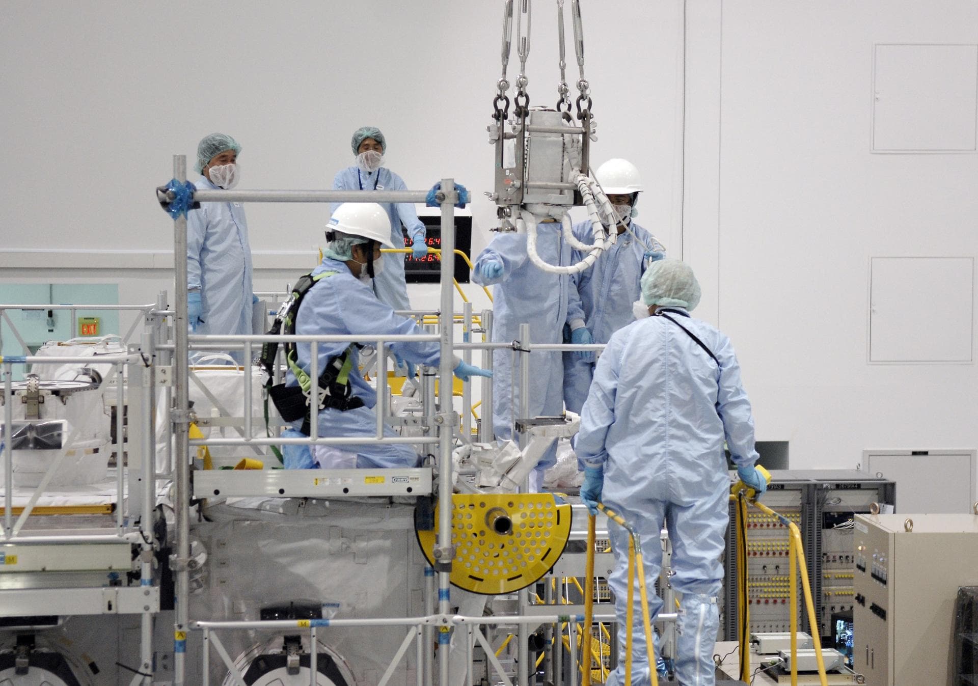 CAPE CANAVERAL, Fla. – In the Space Station Processing Facility at NASA's Kennedy Space Center in Florida, STS-127 crew members get hands-on familiarization with equipment to be used on the mission.