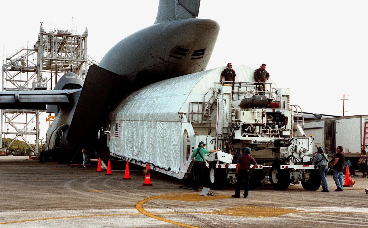 KENNEDY SPACE CENTER, FLA. -- The Chandra X-ray Observatory is unloaded from an Air Force C-5 Galaxy transporter two days after landing at the Shuttle Landing Facility on Feb. 4. The observatory sits 