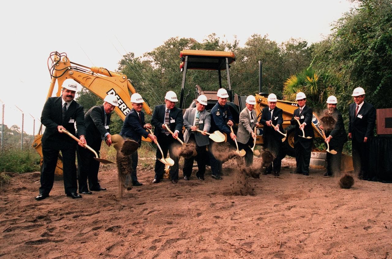 Dirt flies during a ground-breaking ceremony to kick off Astrotech Space Operations' construction of a new satellite preparation facility to support the Delta IV, Boeing's winning entrant in the Air F
