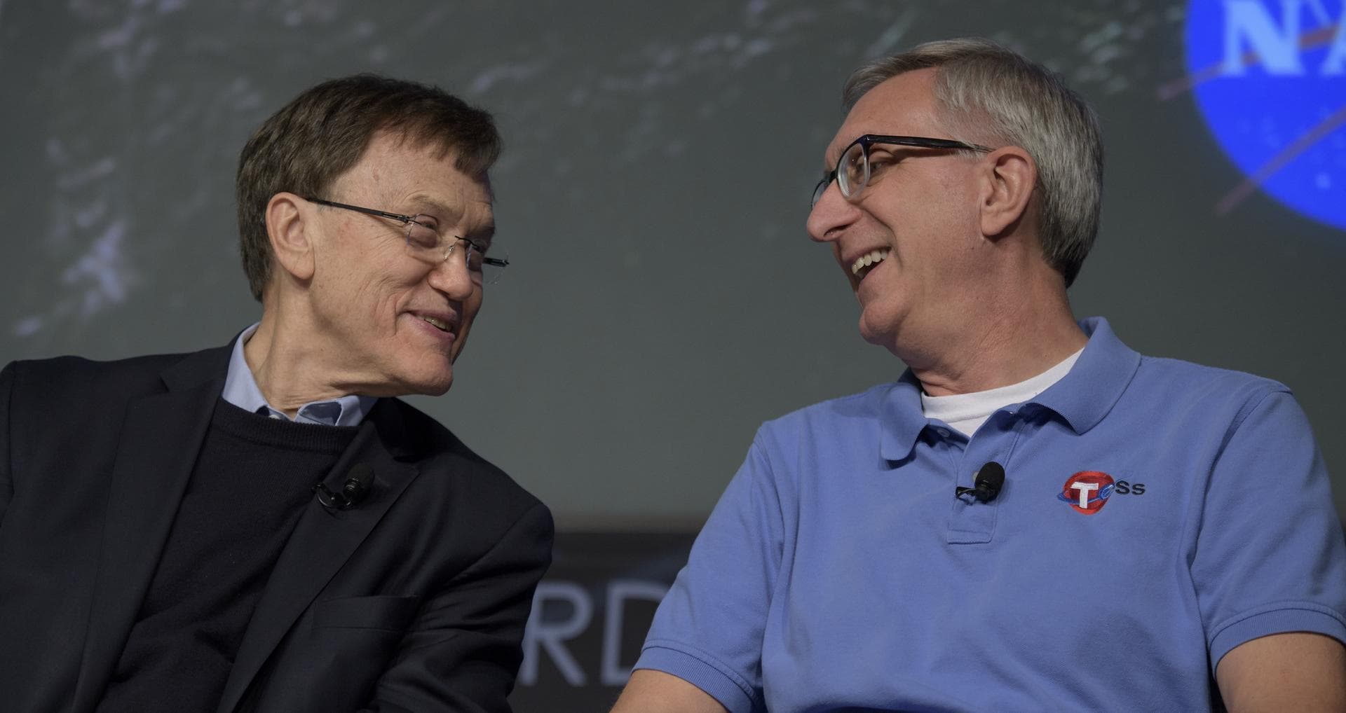 George Ricker, TESS principal investigator, MIT Kavli Institute for Astrophysics and Space Research, left, and Jeff Volosin, TESS project manager, NASA’s Goddard Space Flight Center, discuss the upcom