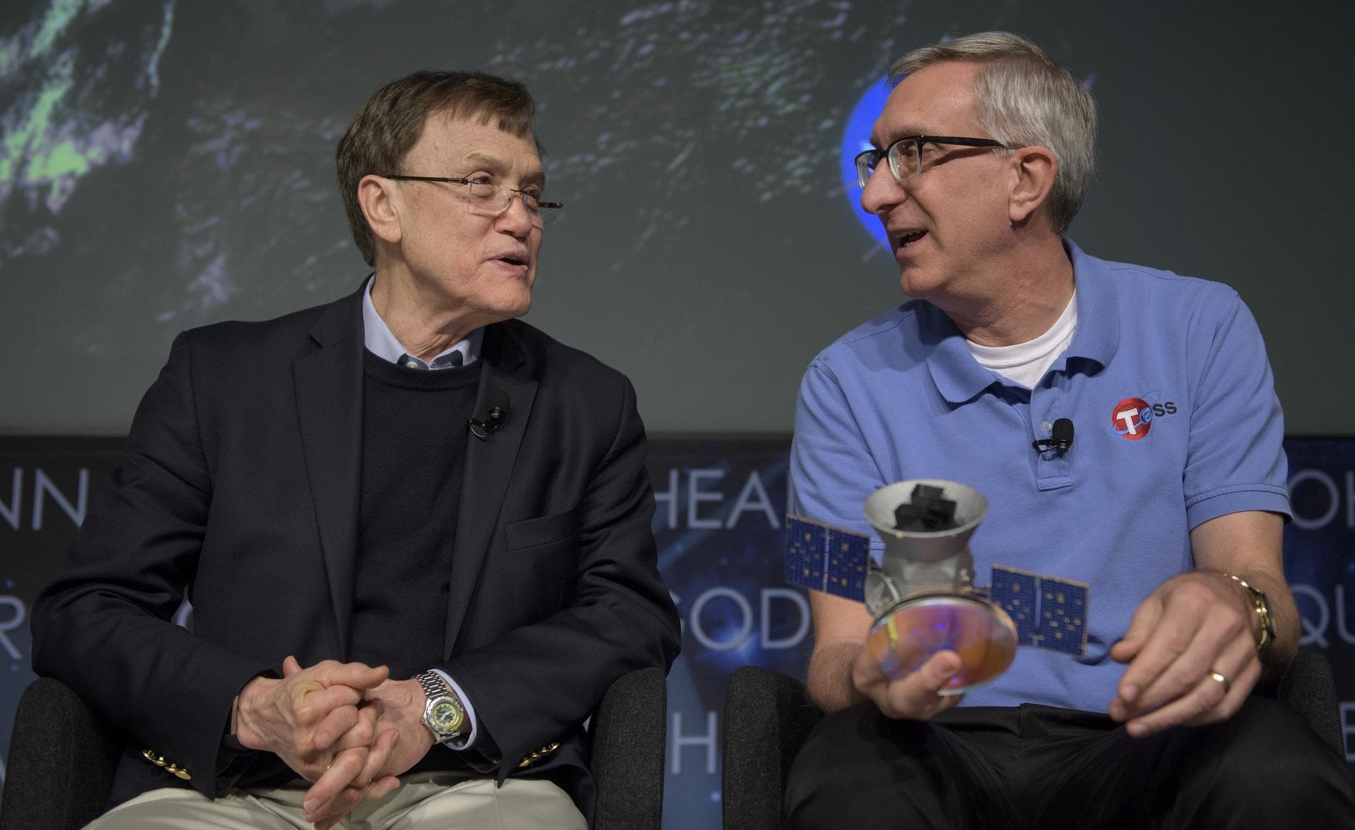 George Ricker, TESS principal investigator, MIT Kavli Institute for Astrophysics and Space Research, left, and Jeff Volosin, TESS project manager, NASA’s Goddard Space Flight Center discuss the upcomi