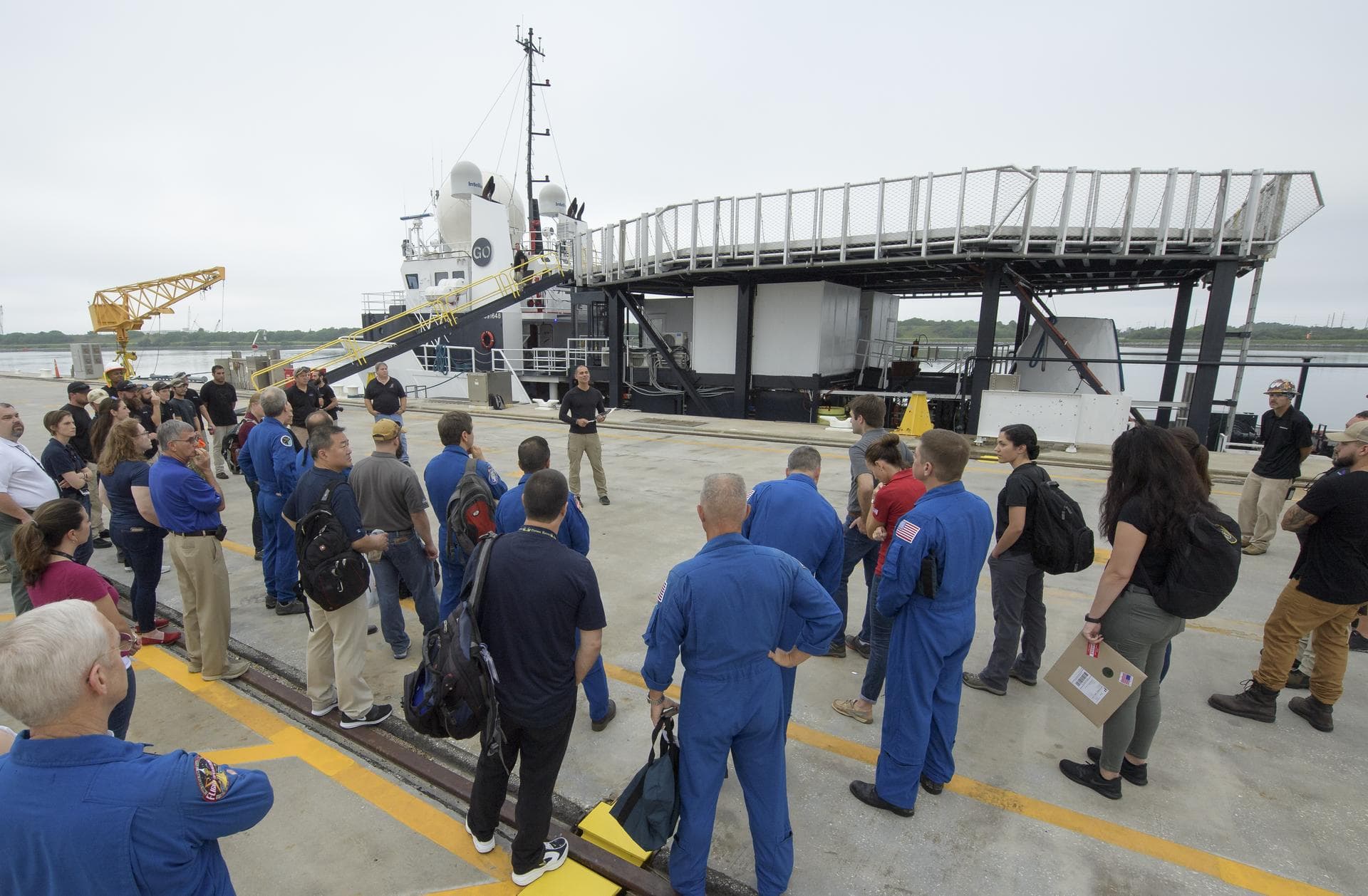 Teams from NASA and SpaceX gather at the Trident Basin in Cape Canaveral, Florida, on August 13, 2019 to rehearse extracting astronauts from SpaceX’s Crew Dragon, which will be used to carry humans to