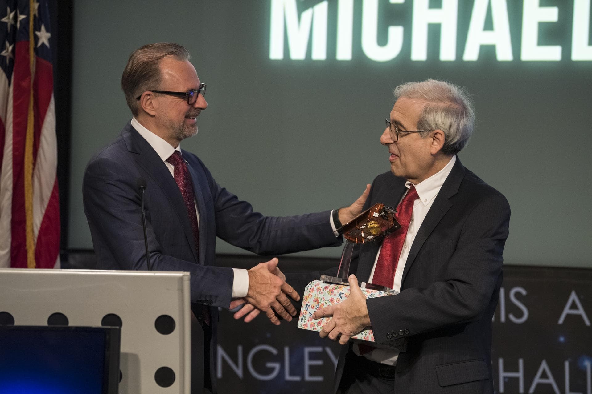 ESA (European Space Agency) director of Earth Observation Programmes, Josef Aschbacher, left, presents NASA’s former director of the Earth Science division, Dr. Michael Freilich with an award after an