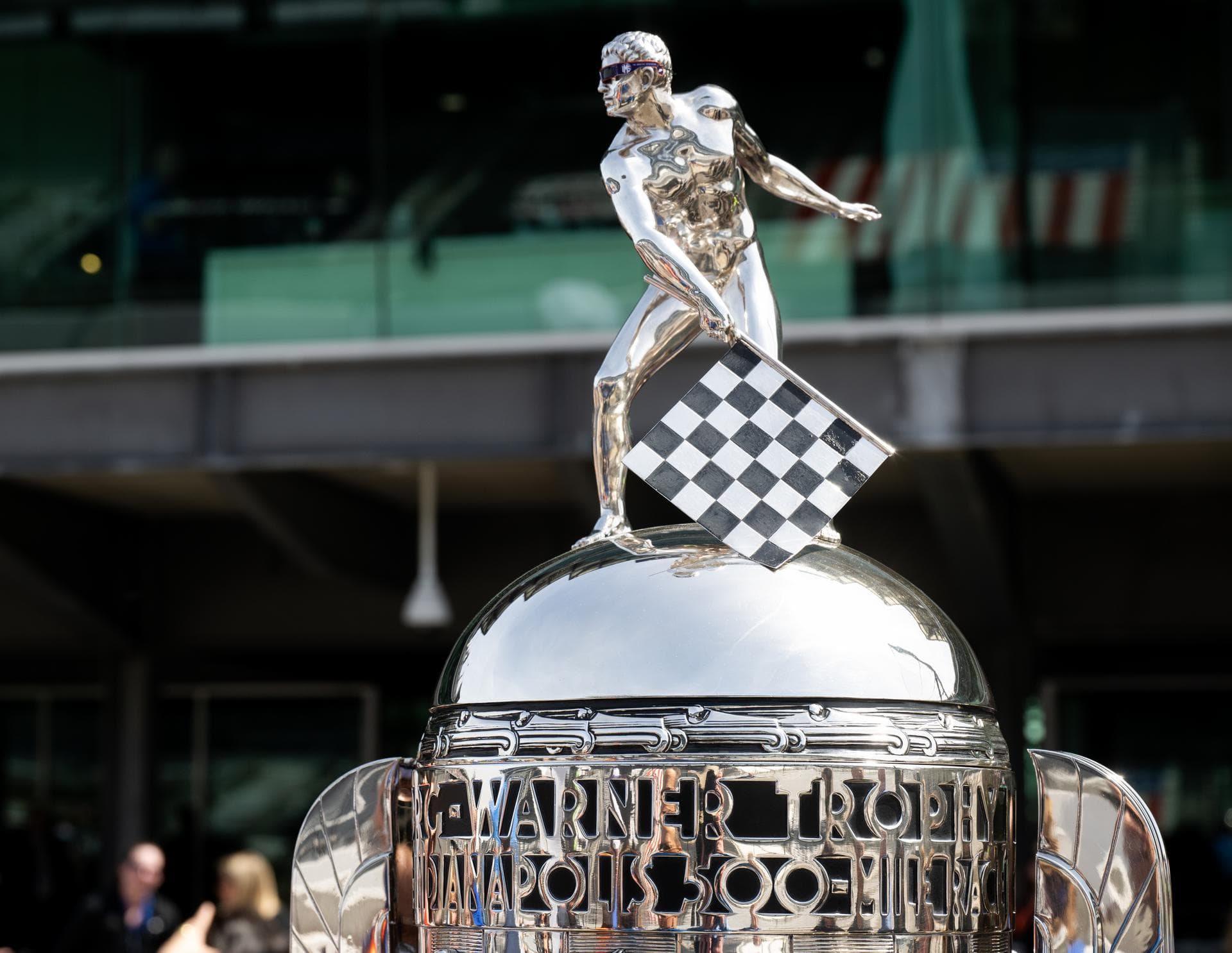 The statue on top of the Borg-Warner trophy is seen wearing solar glasses at the Indianapolis Motor Speedway ahead of the total solar eclipse, Monday, April 8, 2024, in Indianapolis, Ind. A total sola