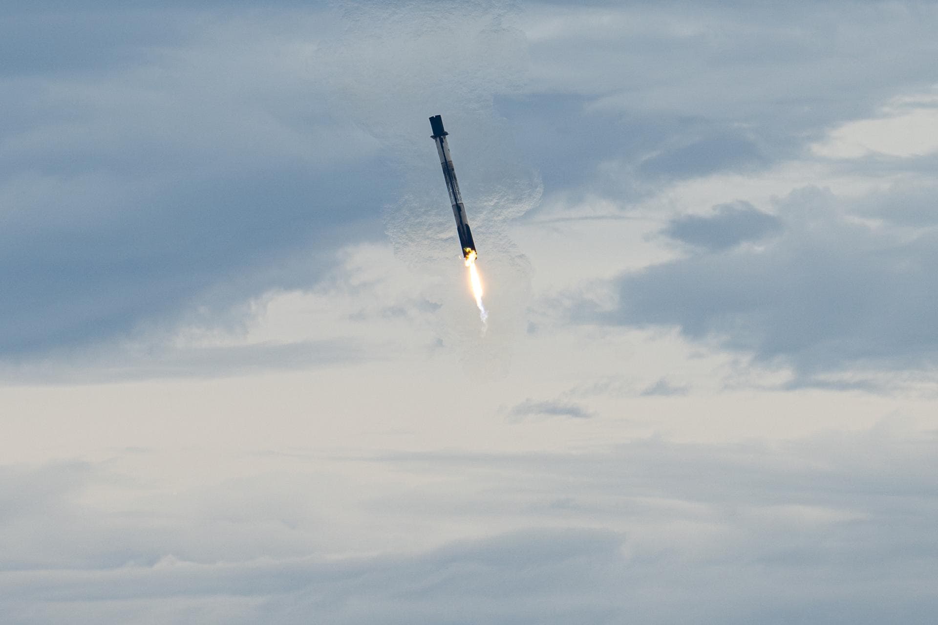 The first stage of a SpaceX Falcon 9 rocket lands at Landing Zone 40, Thursday, Oct. 1, 2026, at Cape Canaveral Space Force Station in Florida. The Falcon 9 first stage supported the launch of NASA’s 