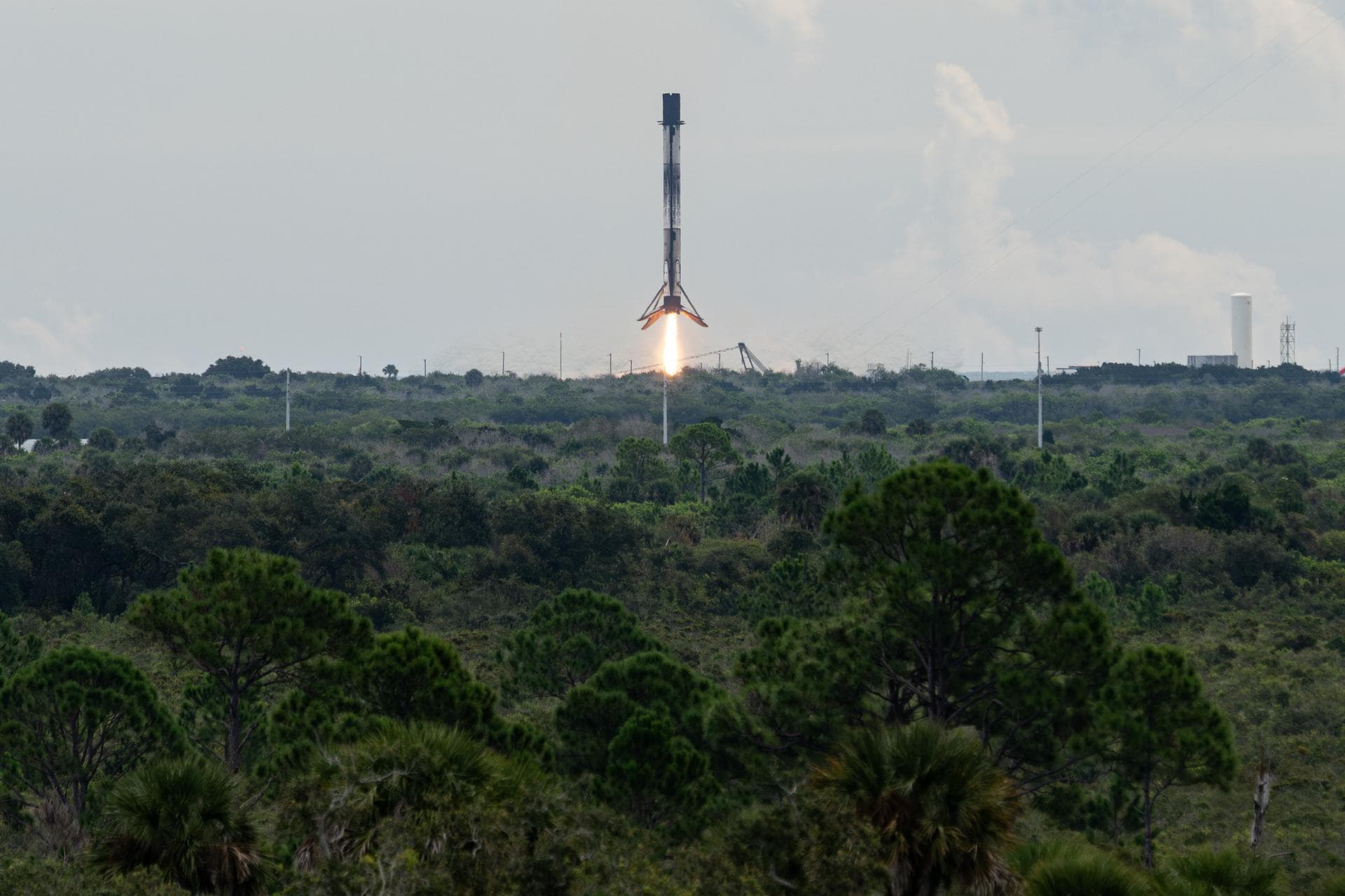 The first stage of a SpaceX Falcon 9 rocket lands at Landing Zone 40, Thursday, Oct. 1, 2026, at Cape Canaveral Space Force Station in Florida. The Falcon 9 first stage supported the launch of NASA’s 