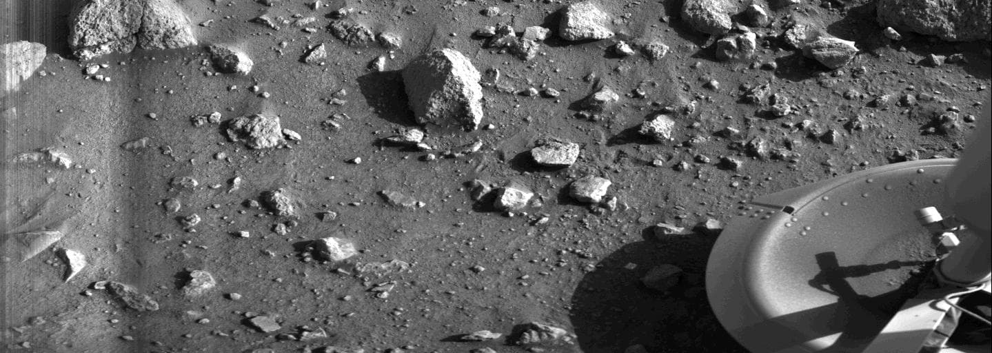 This is the first photograph ever taken on the surface of the planet Mars. It was obtained by Viking 1 just minutes after the spacecraft landed successfully early today [July 20, 1976]. The center of 