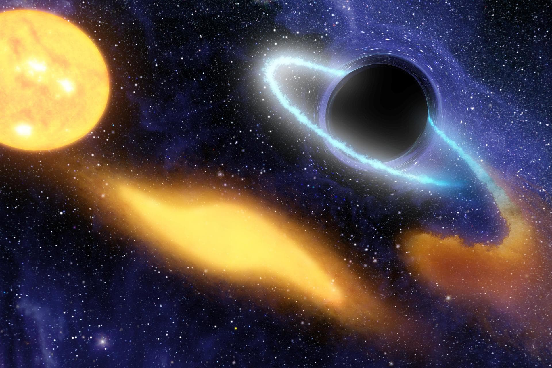 This artist concept shows a supermassive black hole at the center of a remote galaxy digesting the remnants of a star.