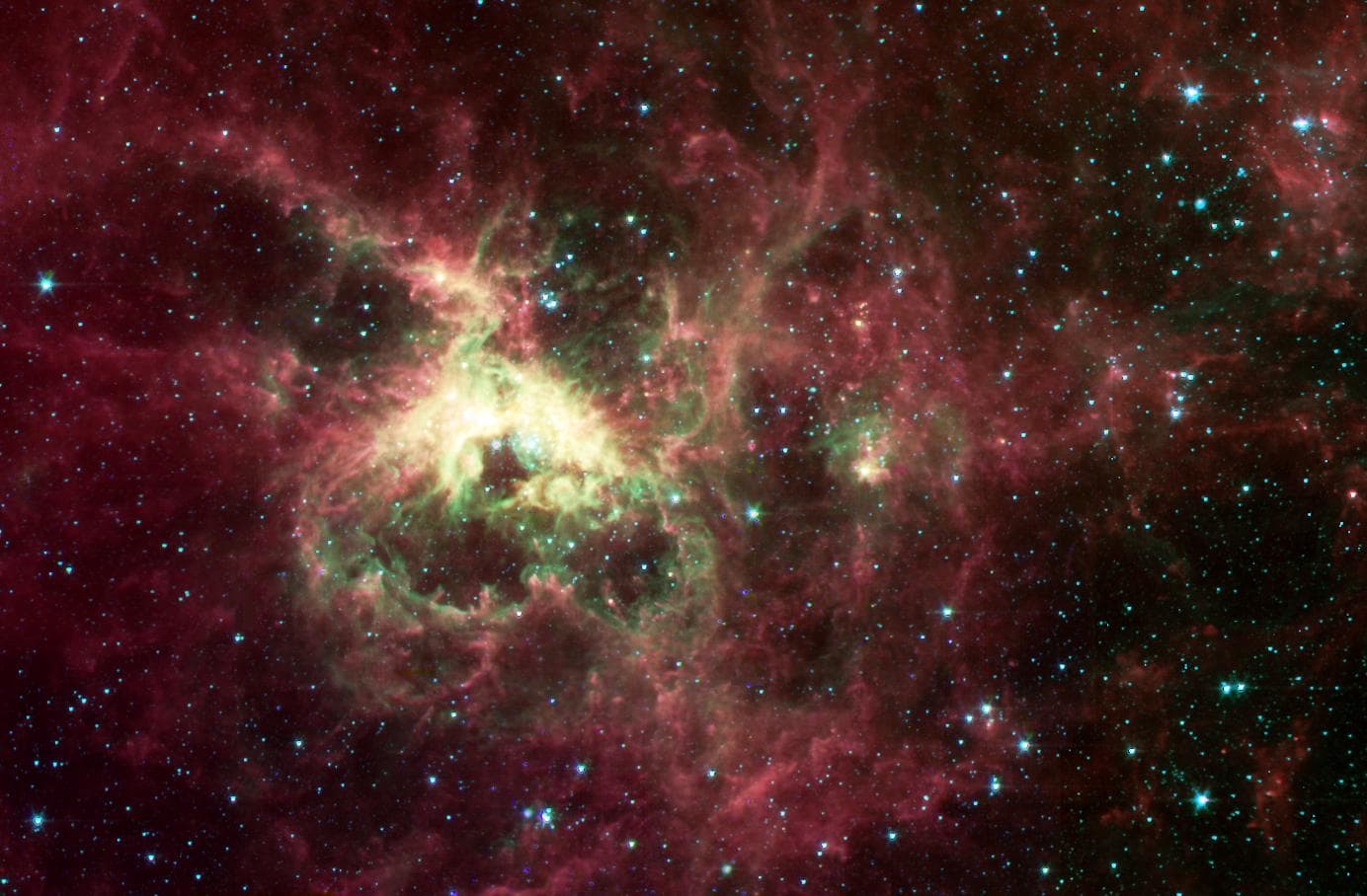 NASA Spitzer Space Telescope, formerly known as the Space Infrared Telescope Facility, has captured in stunning detail the spidery filaments and newborn stars of theTarantula Nebula, a rich star-formi