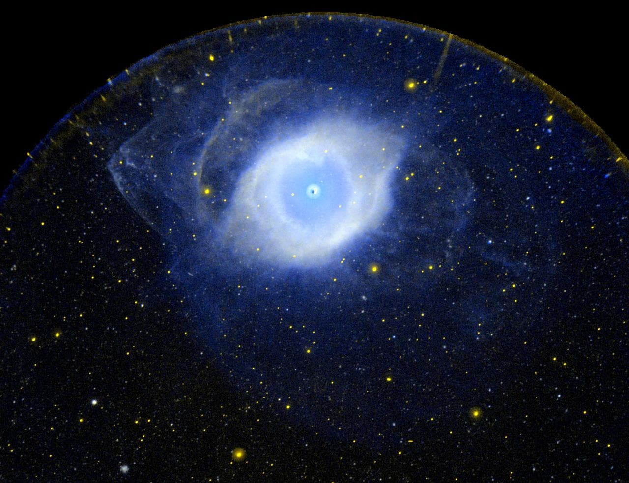 This ultraviolet image from NASA Galaxy Evolution Explorer is of the planetary nebula NGC 7293 also known as the Helix Nebula. It is the nearest example of what happens to a star, like our own Sun, as