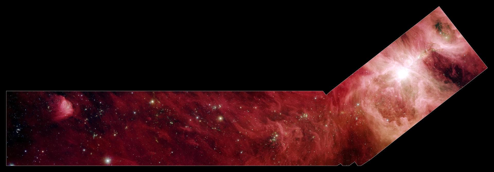 This image composite shows a part of the Orion constellation surveyed by NASA Spitzer Space Telescope. The shape of the main image was designed by astronomers to roughly follow the shape of Orion clou