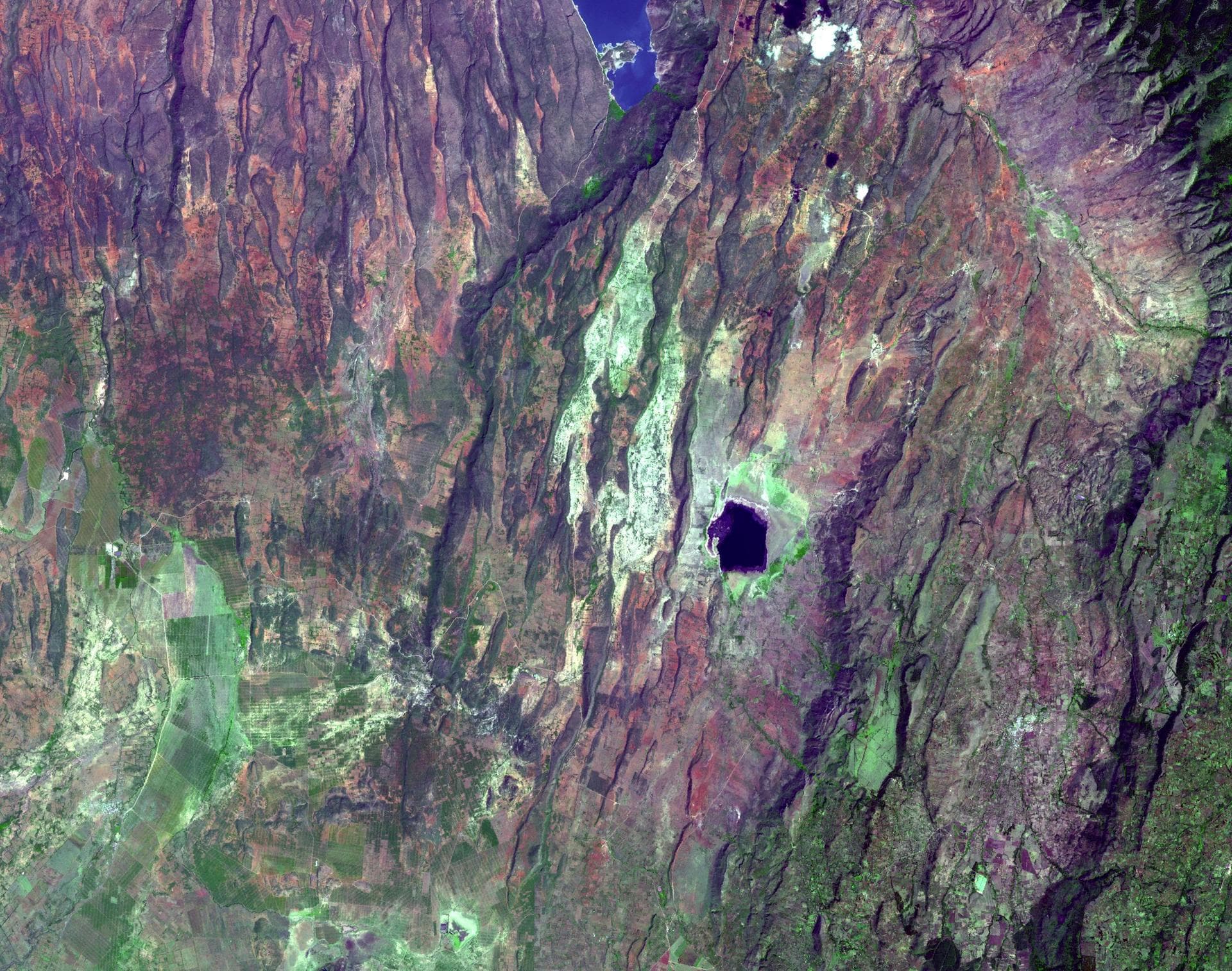 This image acquired by NASA Terra satellite on December 18, 2002 shows the East African rift -- places where the earth crust has formed deep fissures and the plates have begun to move apart.