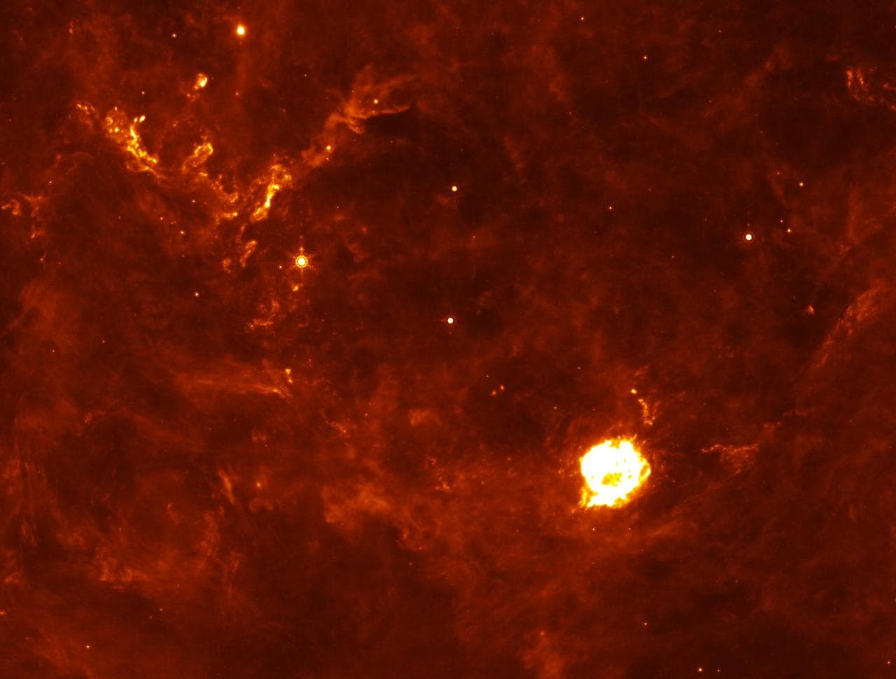 The Cassiopeia A supernova first flash of radiation makes six clumps of dust circled in annotated version unusually hot. The supernova remnant is the large white ball in the center. This infrared pict