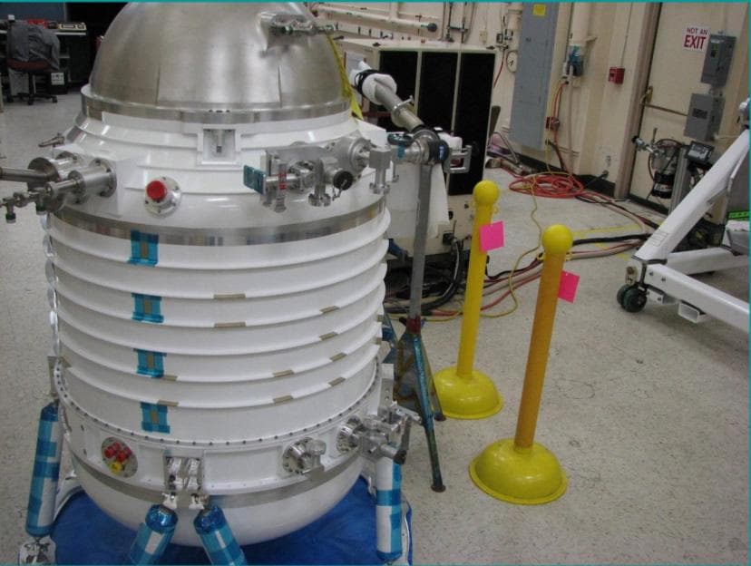 Initial assembly of NASA Wide-field Infrared Survey Explorer cryostat. The cryostat is a 2-stage solid hydrogen dewar that is used to cool the WISE optics and detectors. Here the cryostat internal str