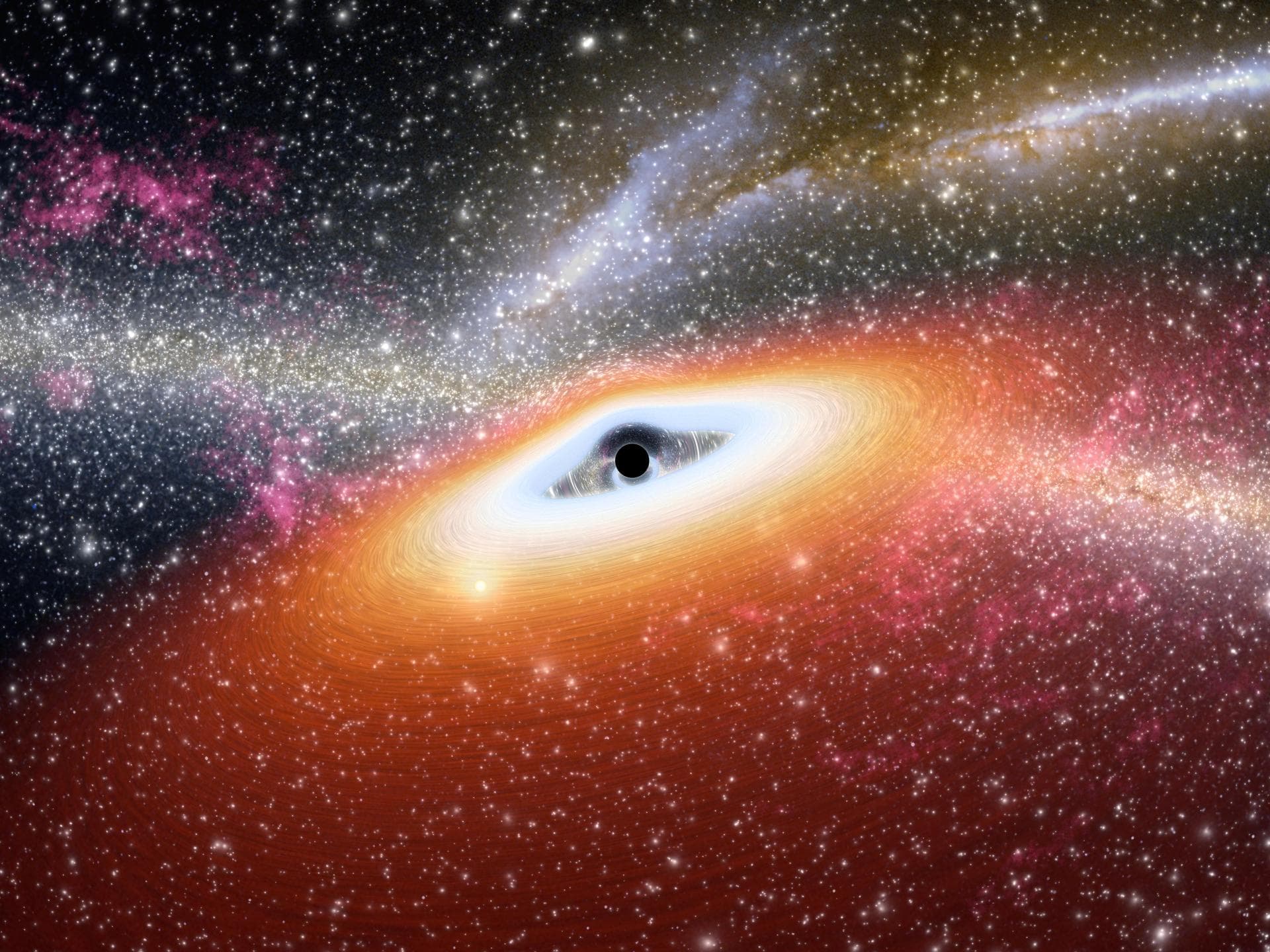 This artist conception illustrates one of the most primitive supermassive black holes known central black dot at the core of a young, star-rich galaxy.