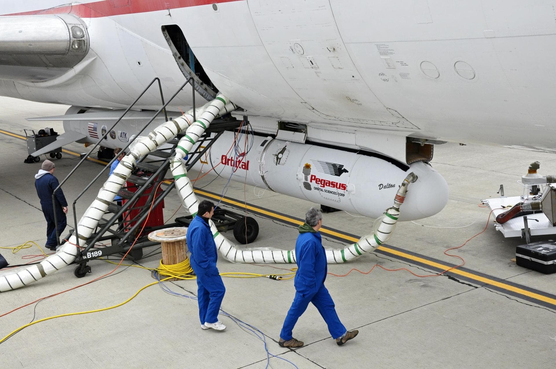 This photo shows the Orbital Sciences Corporation Pegasus XL rocket with NASA NuSTAR spacecraft after attachment to the L-1011 carrier aircraft known as Stargazer.