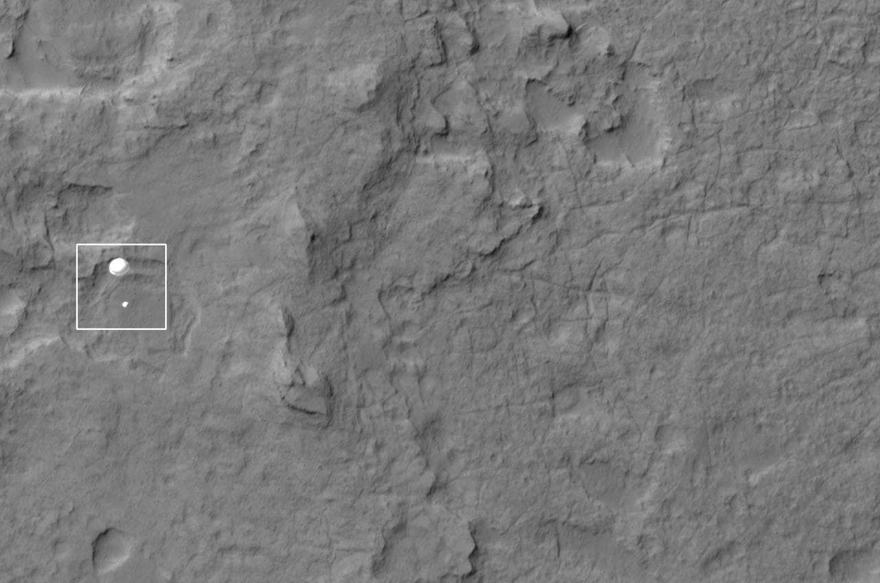 NASA Curiosity rover and its parachute were spotted by NASA Mars Reconnaissance Orbiter as Curiosity descended to the surface on Aug. 5 PDT Aug. 6 EDT. Curiosity and its parachute are in the center of