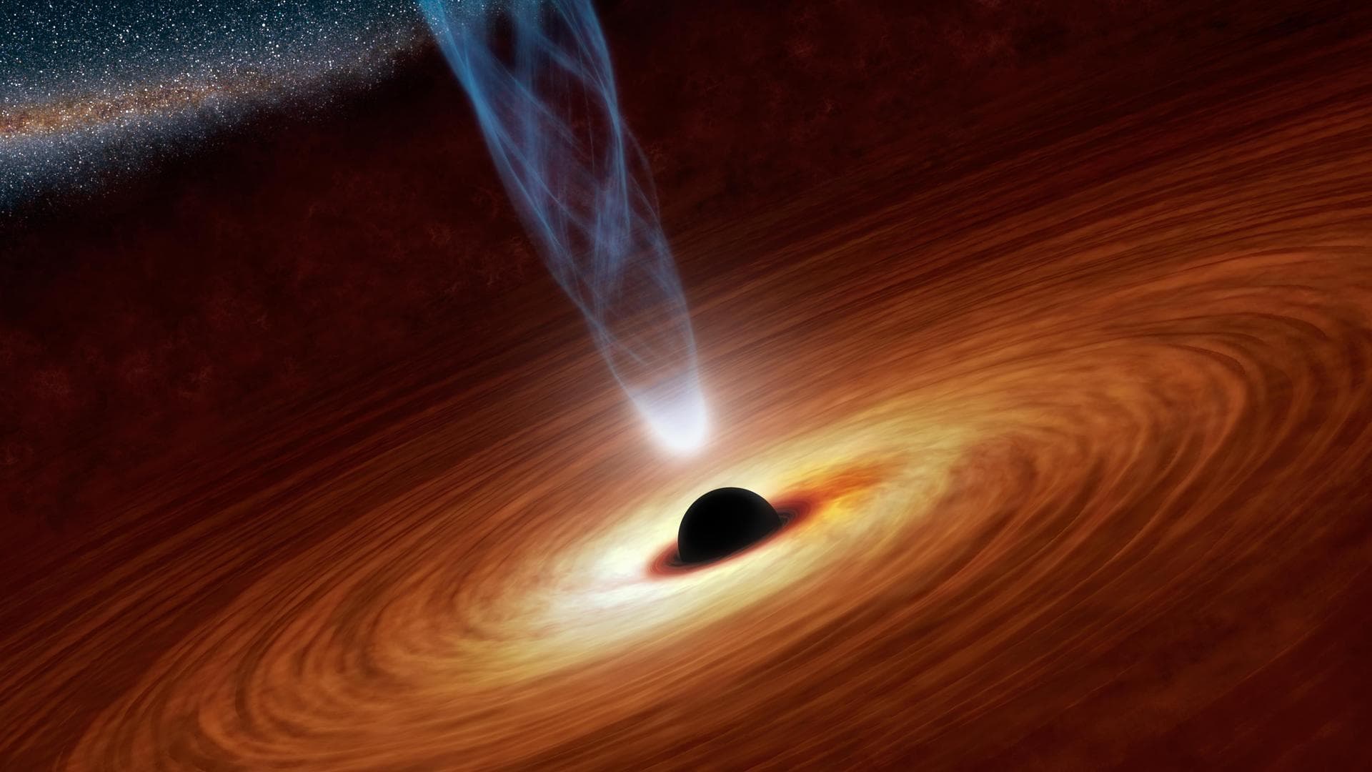 This artist concept illustrates a supermassive black hole with millions to billions times the mass of our sun. Supermassive black holes are enormously dense objects buried at the hearts of galaxies.