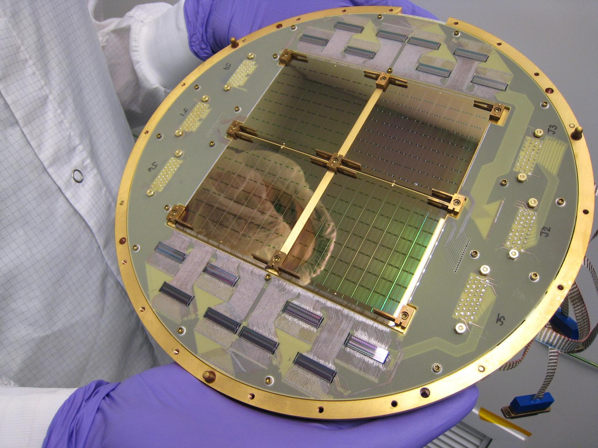 This image shows an array of the 512 superconducting detectors used on the BICEP2 telescope at the South Pole. The technology was key to detecting the effects of gravitational waves associated with th
