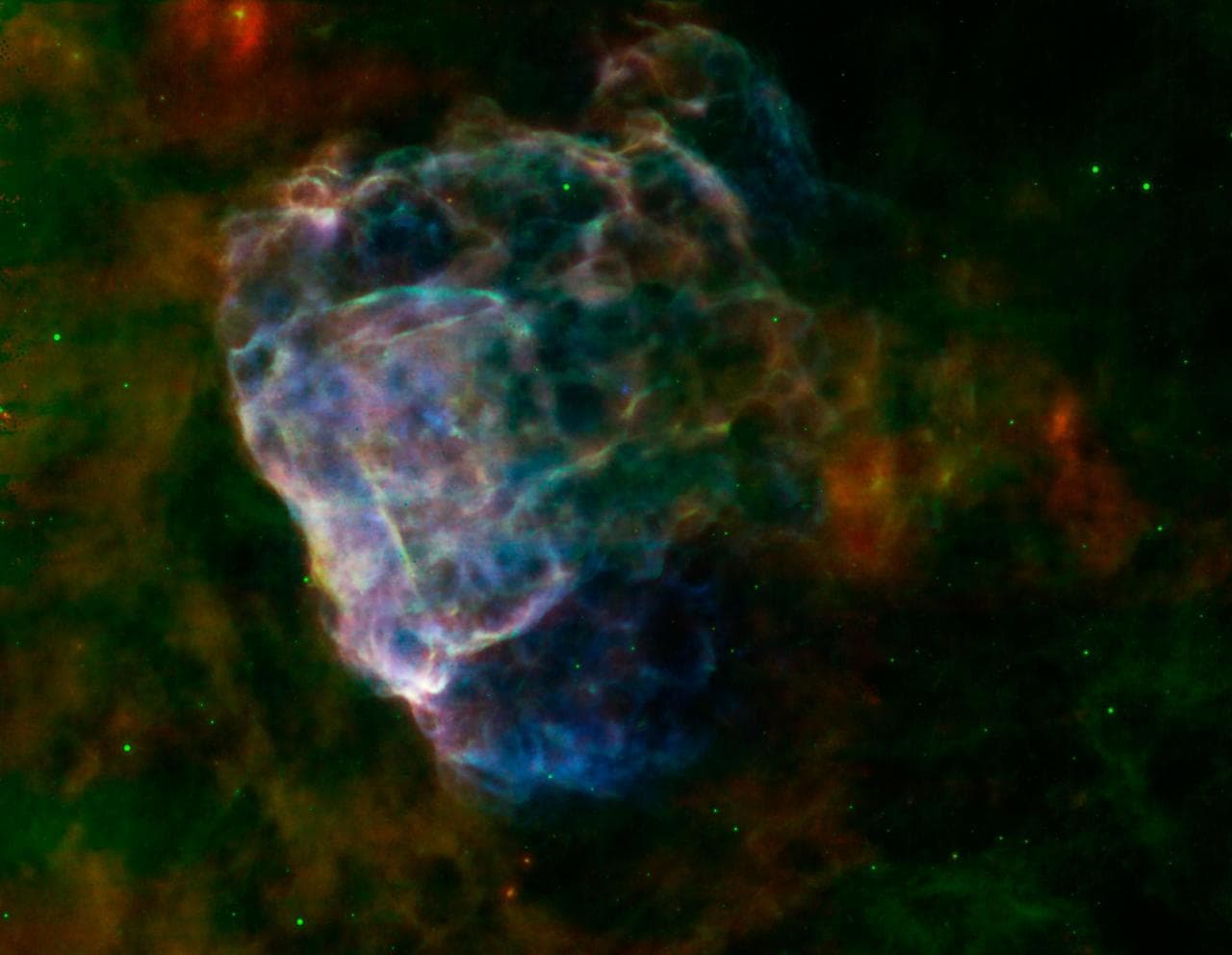 Puppis A, around 7,000 light-years away, is seen in this image from NASA Spitzer Space Telescope and Chandra X-Ray Observatory, and the European Space Agency XMM-Newton.