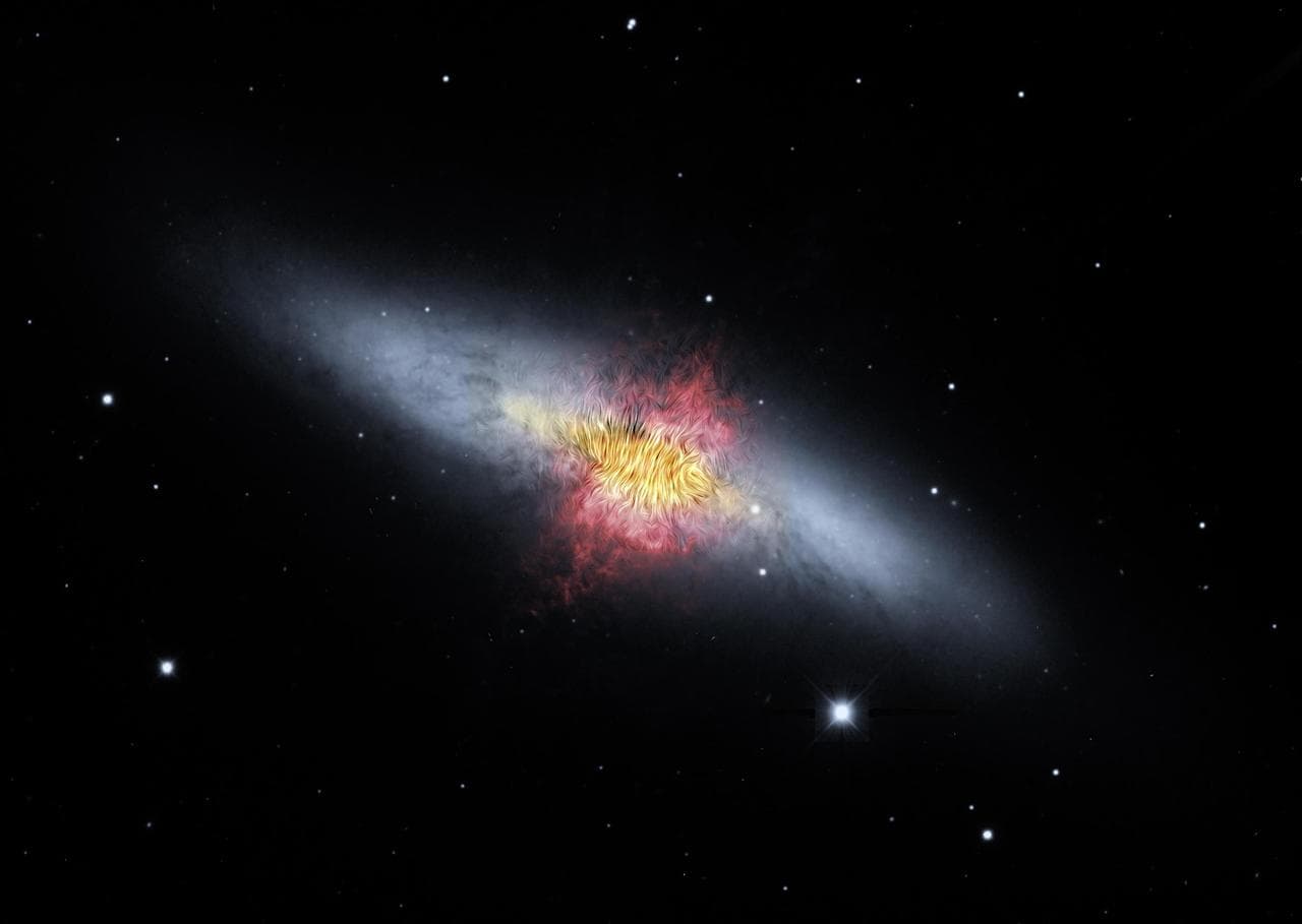 A composite image of the Cigar Galaxy (also called M82), a starburst galaxy about 12 million light-years away in the constellation Ursa Major. The magnetic field detected by the High-resolution Airbor