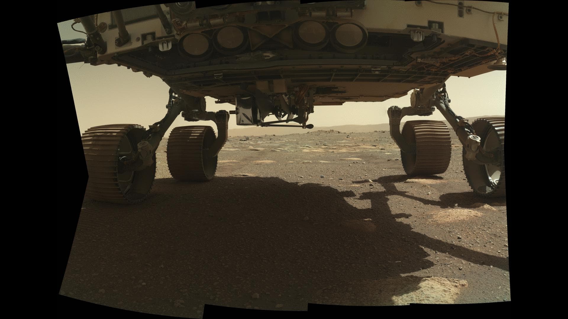NASA's Ingenuity Mars Helicopter can be seen on the belly of the Perseverance rover on March 26, 2021, the 36th Martian day, or sol, of the mission. The helicopter's launch lock, which holds it in pla