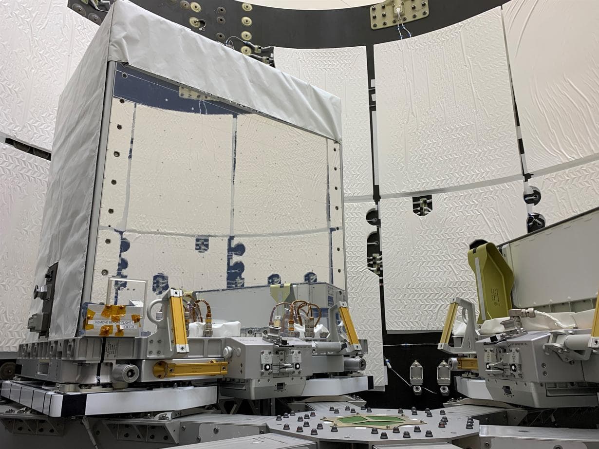 The Earth Surface Mineral Dust Source Investigation (EMIT) mission instrument (left) sits in the "trunk" that will travel aboard SpaceX's 25th cargo resupply mission – planned for June 7, 2022 – to th