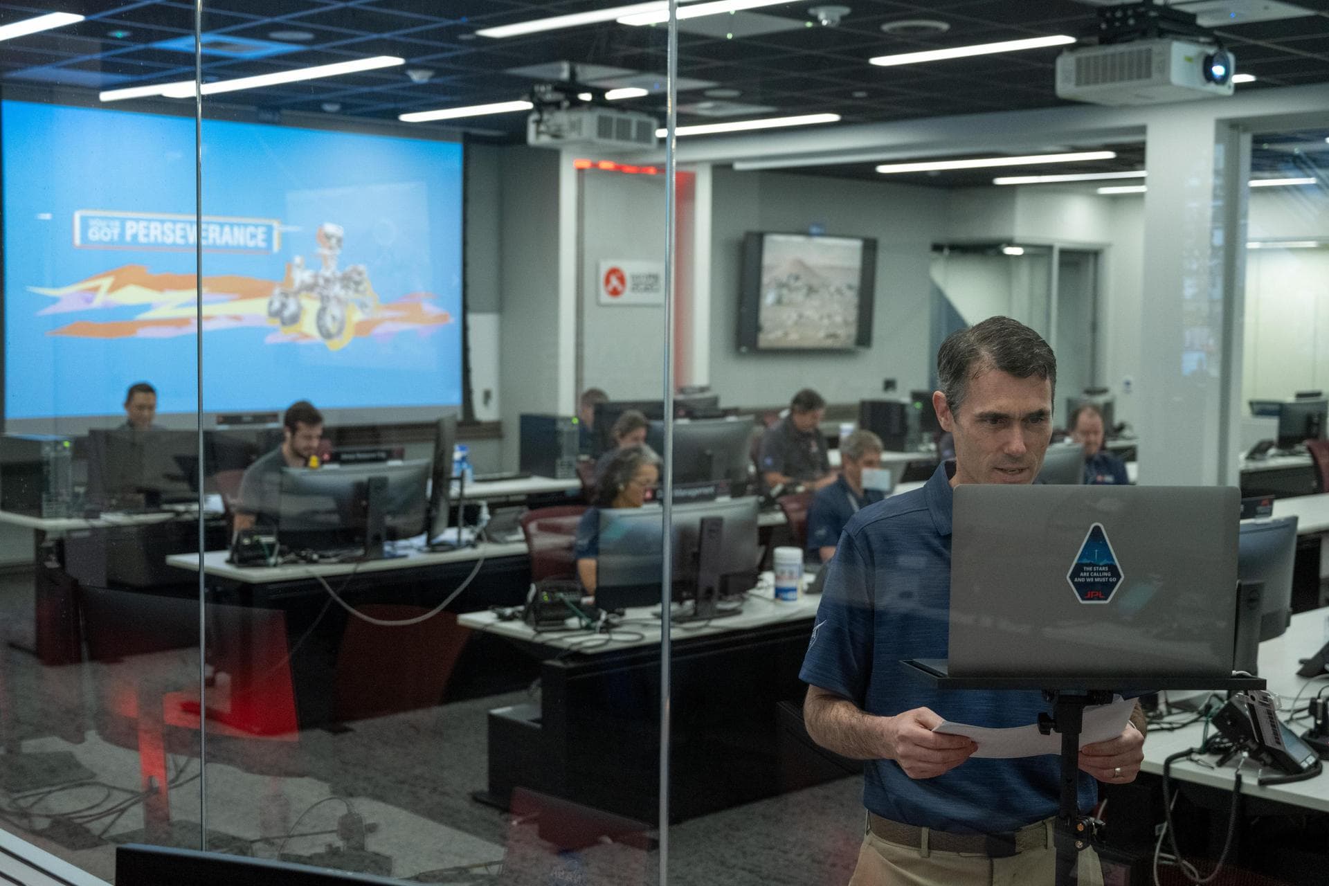 On April 5, 2022, inside the Mars Perseverance rover control room at NASA's Jet Propulsion Laboratory in Southern California, the rover team's deputy mission manager, Robert Hogg, and other team membe