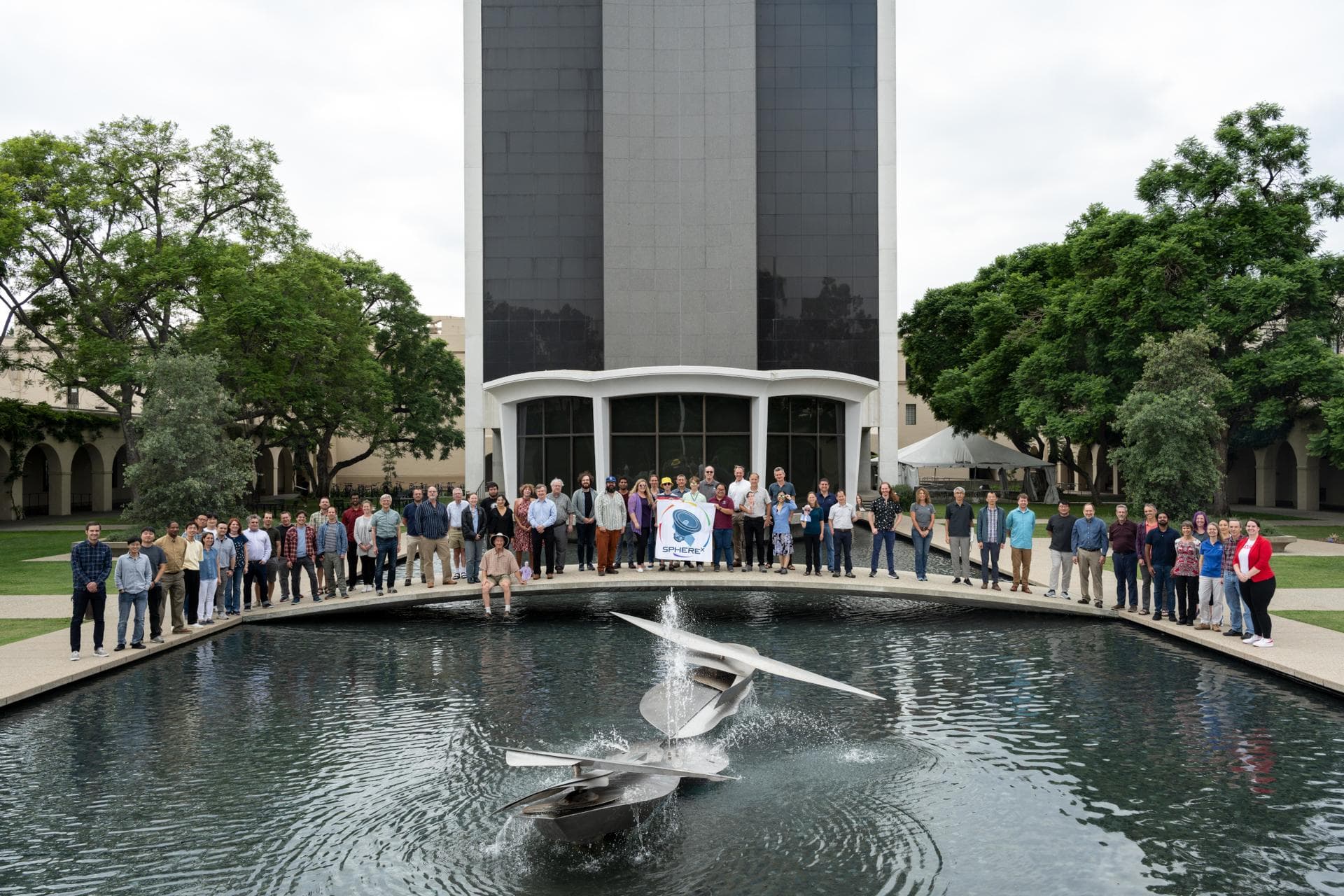 Members of the SPHEREx mission team pose for a photo on the campus of Caltech in Pasadena, California, in October 2023. Short for Spectro-Photometer for the History of the Universe, Epoch of Reioniza
