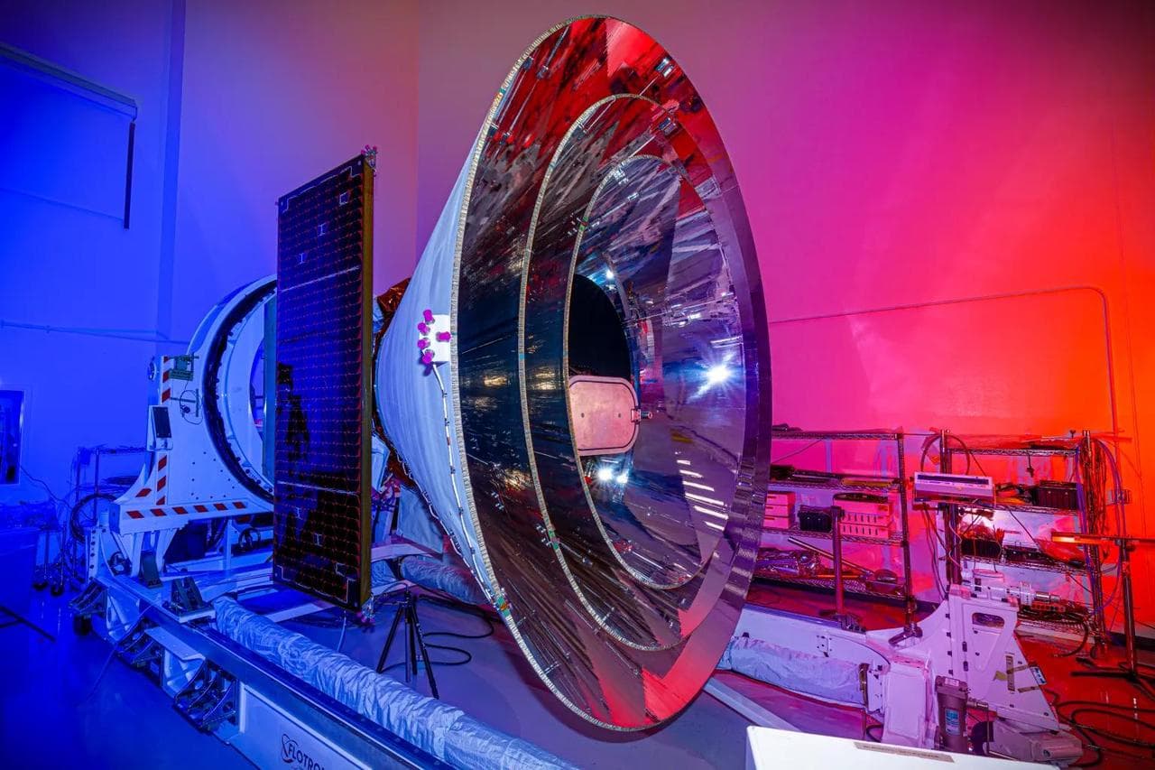 NASA's SPHEREx space observatory was photographed at BAE Systems in Boulder, Colorado, in November 2024 after completing environmental testing. The spacecraft's three concentric cones help direct heat