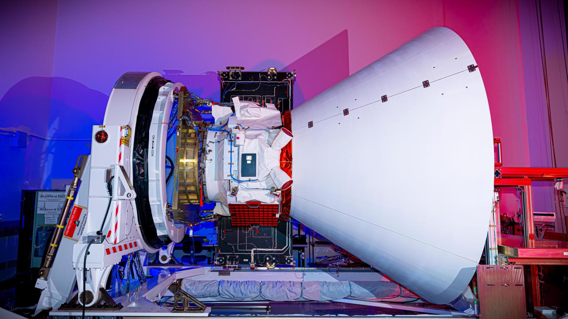 The SPHEREx observatory sits in a clean room after environmental testing at BAE Systems in Boulder, Colorado, in late 2024.  Short for Spectro-Photometer for the History of the Universe, Epoch of Reio