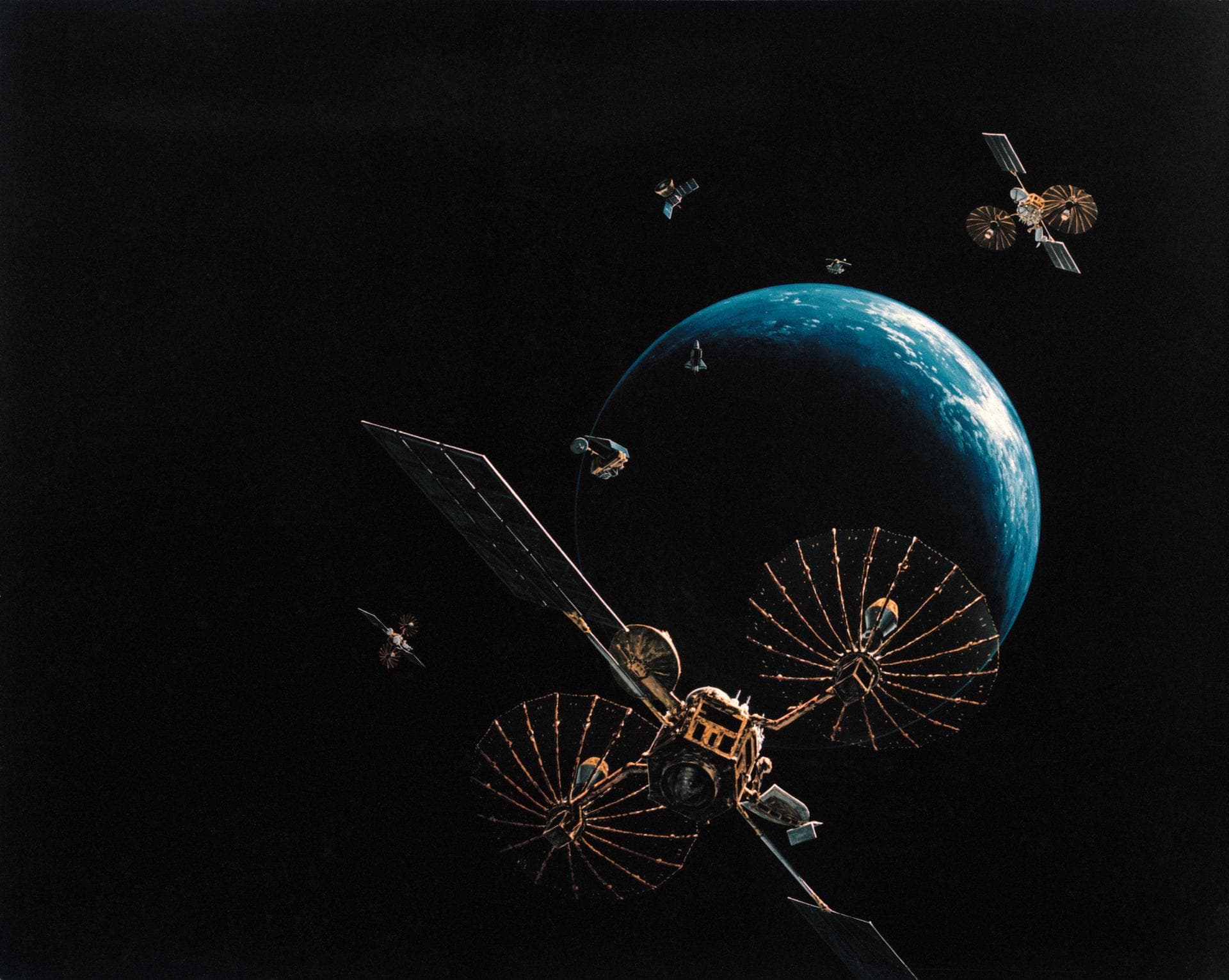 Artist concept shows the Tracking and Data Relay Satellite E (TDRS-E) augmenting a sophisticated TDRS system (TDRSS) communications network after deployment during STS-43 from Atlantis, Orbiter Vehicl