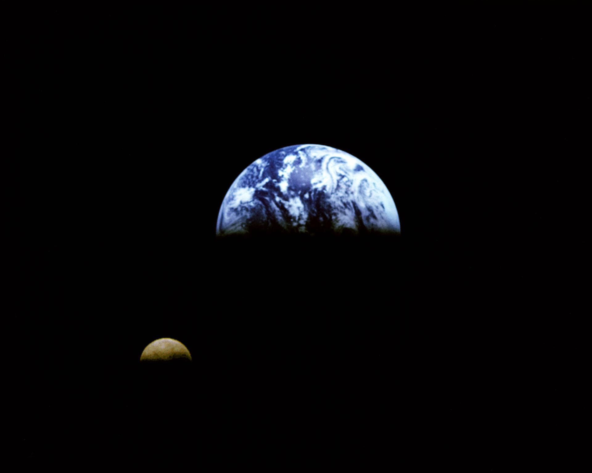 Eight days after its encounter with the Earth, the Galileo spacecraft was able to look back and capture this remarkable view of the Moon in orbit about the Earth, taken from a distance of about 6.2 mi