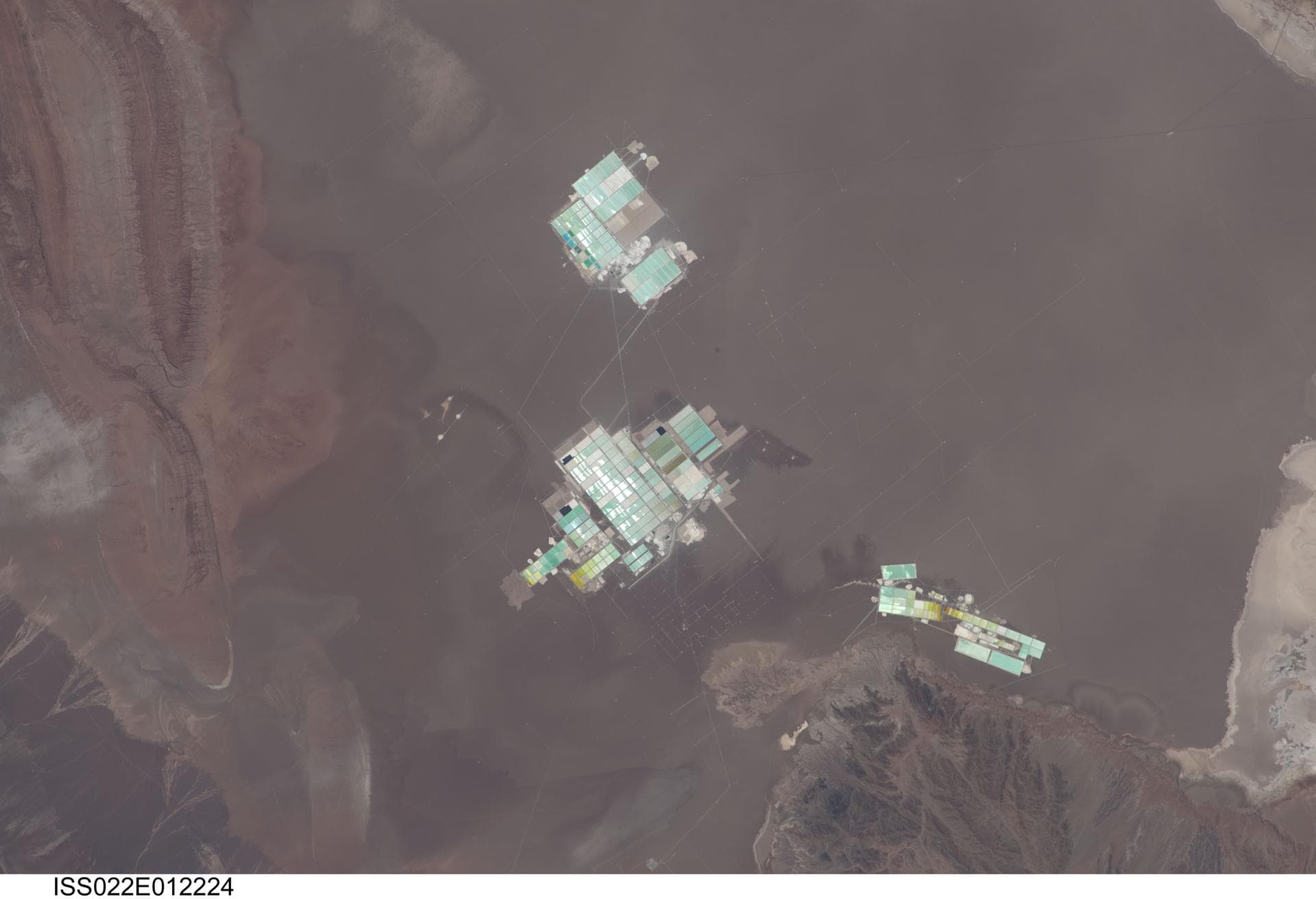 ISS022-E-012224 (15 Dec. 2009) --- Evaporation ponds in the Salar de Atacama, Chile are featured in this image photographed by an Expedition 22 crew member on the International Space Station. The Sala