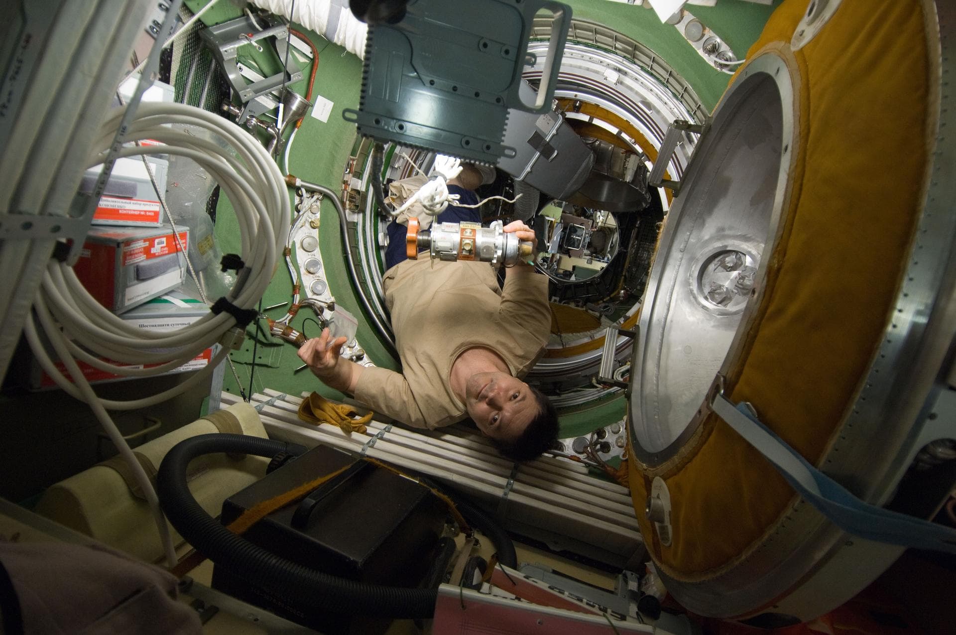 ISS030-E-177117 (12 March 2012) --- Russian cosmonaut Oleg Kononenko, Expedition 30 flight engineer, performs removal and replacement of the KVD Pressure Equalization Valve (PEV) in the transfer compa