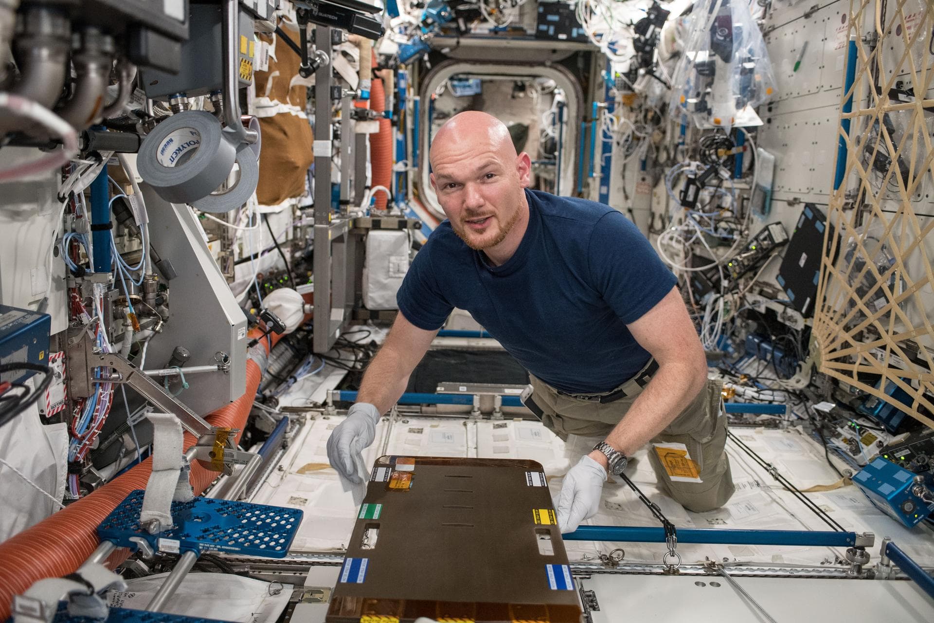 iss056e130414 (July 28, 2018) --- Astronaut Alexander Gerst of ESA (European Space Agency) cleans the Crew Medical Restraint System (CMRS) inside the International Space Station's U.S. Destiny Laborat