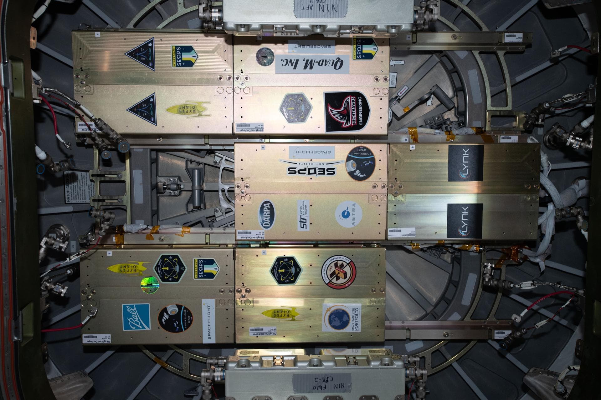 iss061e147761 (1/31/2020) ---  A view from the Unity module aboard the International Space Station (ISS) of the Northrop Grumman NG-12 hatch. Attached to the hatch is the SlingShot small satellite dep